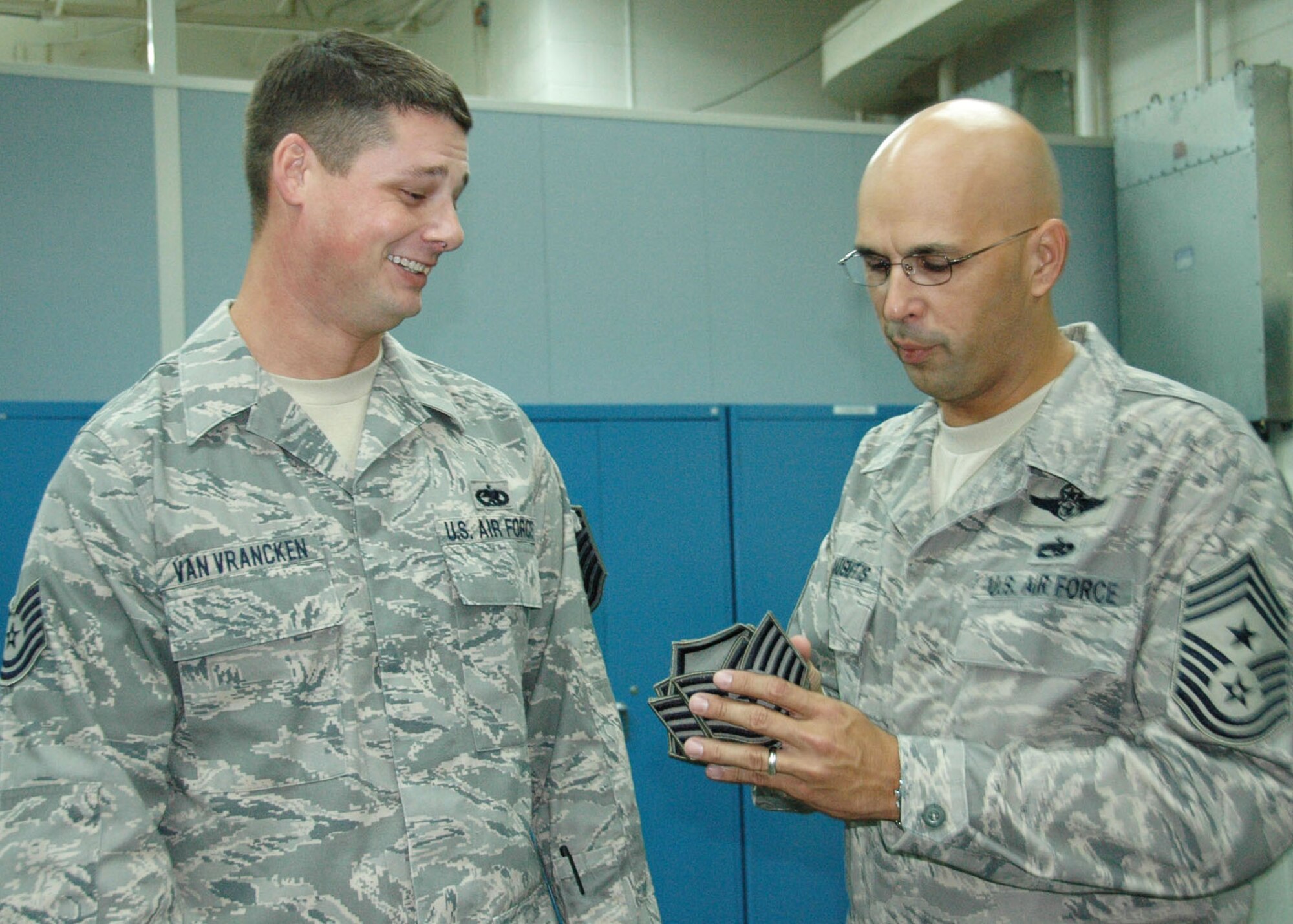 Master Sgt. Duane Van Vrancken, 919th Maintenance Squadron, left, reacts as Chief Master Sgt.  Michael Klausutis, 919th Special Operations Wing command chief, presents him with new stripes during a surprise promotion ceremony Oct. 2 at Duke Field.   Sergeant Van Vrancken was one of eight Duke Field reservists awarded immediate Promotion Enhancement Program promotions during the wing’s October unit training assembly.  The PEP is a commander’s program designed to promote outstanding and well-deserving Air Force Reserve Airmen one grade above the authorized grade for their position.  Only those Airmen who show outstanding potential are considered based on a demonstrated ability to serve in the next higher grade.  (U.S. Air Force photo/Dan Neely)