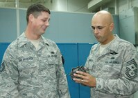 Master Sgt. Duane Van Vrancken, 919th Maintenance Squadron, left, reacts as Chief Master Sgt.  Michael Klausutis, 919th Special Operations Wing command chief, presents him with new stripes during a surprise promotion ceremony Oct. 2 at Duke Field.   Sergeant Van Vrancken was one of eight Duke Field reservists awarded immediate Promotion Enhancement Program promotions during the wing’s October unit training assembly.  The PEP is a commander’s program designed to promote outstanding and well-deserving Air Force Reserve Airmen one grade above the authorized grade for their position.  Only those Airmen who show outstanding potential are considered based on a demonstrated ability to serve in the next higher grade.  (U.S. Air Force photo/Dan Neely)