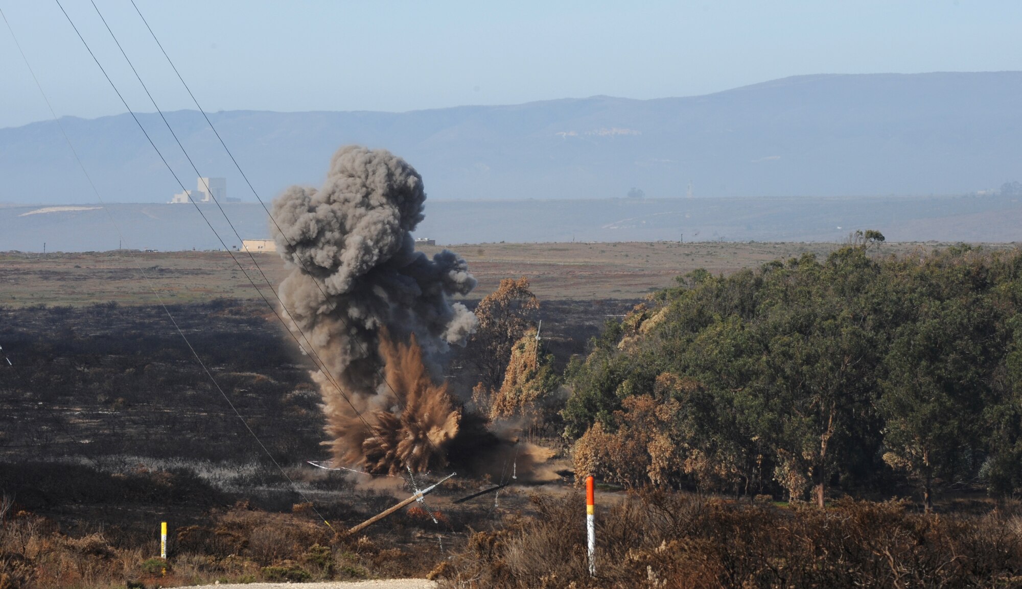 VANDENBERG AIR FORCE BASE, Calif.  - The 30th Civil Engineer Squadron explosive ordnance disposal technicians conducted a blow-in-place on an unexploded ordnance found here Wednesday, Nov. 3, 2010. The EOD technicians found the UXO while conducting a sweep of the area on South Base a week after the Bear Creek Fire incident. Sweeps are conducted to keep the base free of hazardous materials.  (U.S. Air Force photo/Senior Airman Ashley Reed)