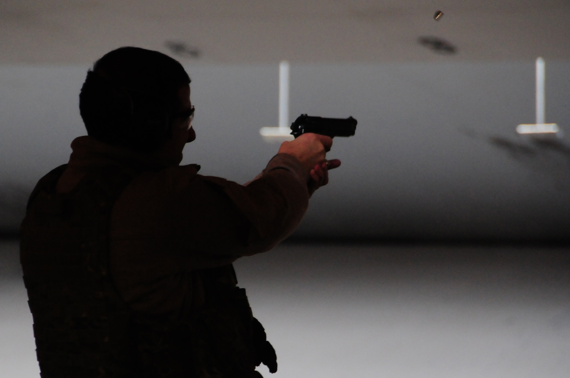 ROYAL AIR FORCE FELTWELL, England – 1st Lt. Evan Kelly, 56th Rescue Squadron HH-60G pilot shoots an M-9 Beretta at his posted target Nov. 02. Students must shoot at different distances from their target to become certified.  (U.S. Air Force photo/Airman 1st Class Erin Zabarnick) 