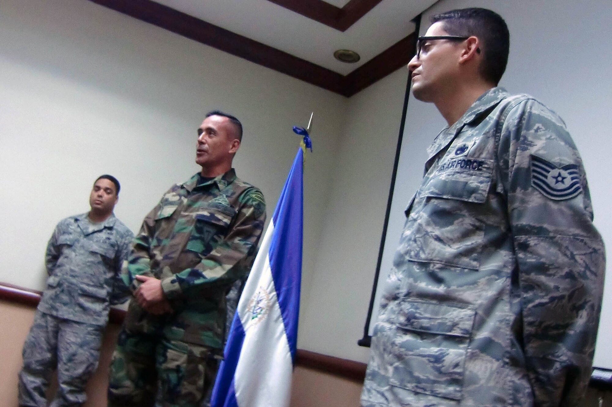 Master Sgt. Fred Campos listens as Col. Walter Arevalo congratulates him on his promotion Oct. 29, 2010 in El Salvador. Sergeant Campos a Salvadoran-American serving in the U.S. Air Force with Special Operations Command South. Colonel Arevalo is the commander of El Salvador's Special Operations Brigade. (Department of Defense photo)