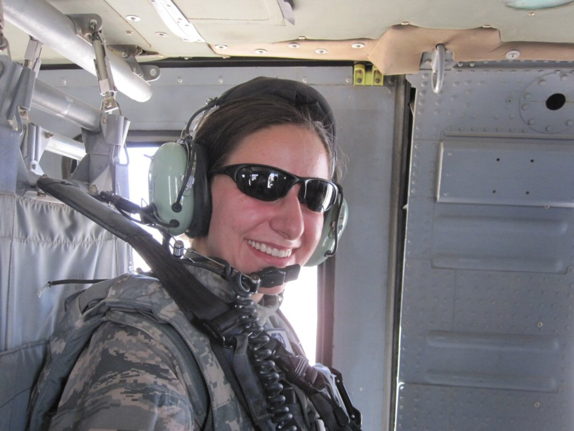 First Lt. Tiffany VanDenBroeke rides in a helicopter over Afghanistan on Sept. 13, 2010, as she performs her deployed mission to help the Afghan army and police force secure a safer future. (courtesy photo)
