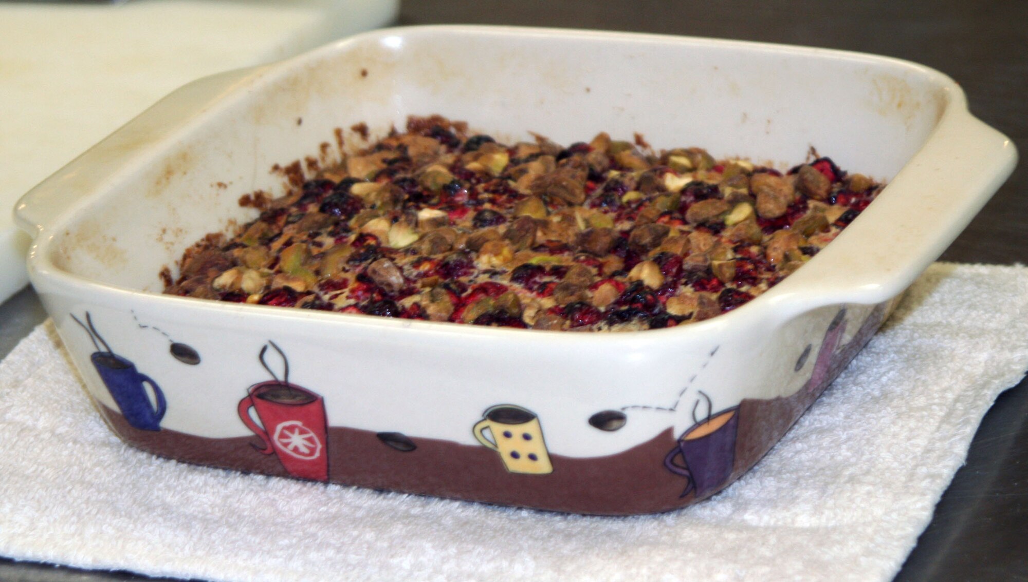 WRIGHT-PATTERSON AIR FORCE BASE, Ohio – Stacy Vaughn, 445th Airlift Wing Public Affairs, is cooking her holiday cranberry-orange pistachio bars for the 3rd Annual Wright-Patt Culinary Competition on Nov. 3 at the Wright-Patterson Air Force Base hospital dining room. Stacy’s completed dish cools before being sliced and plated. 