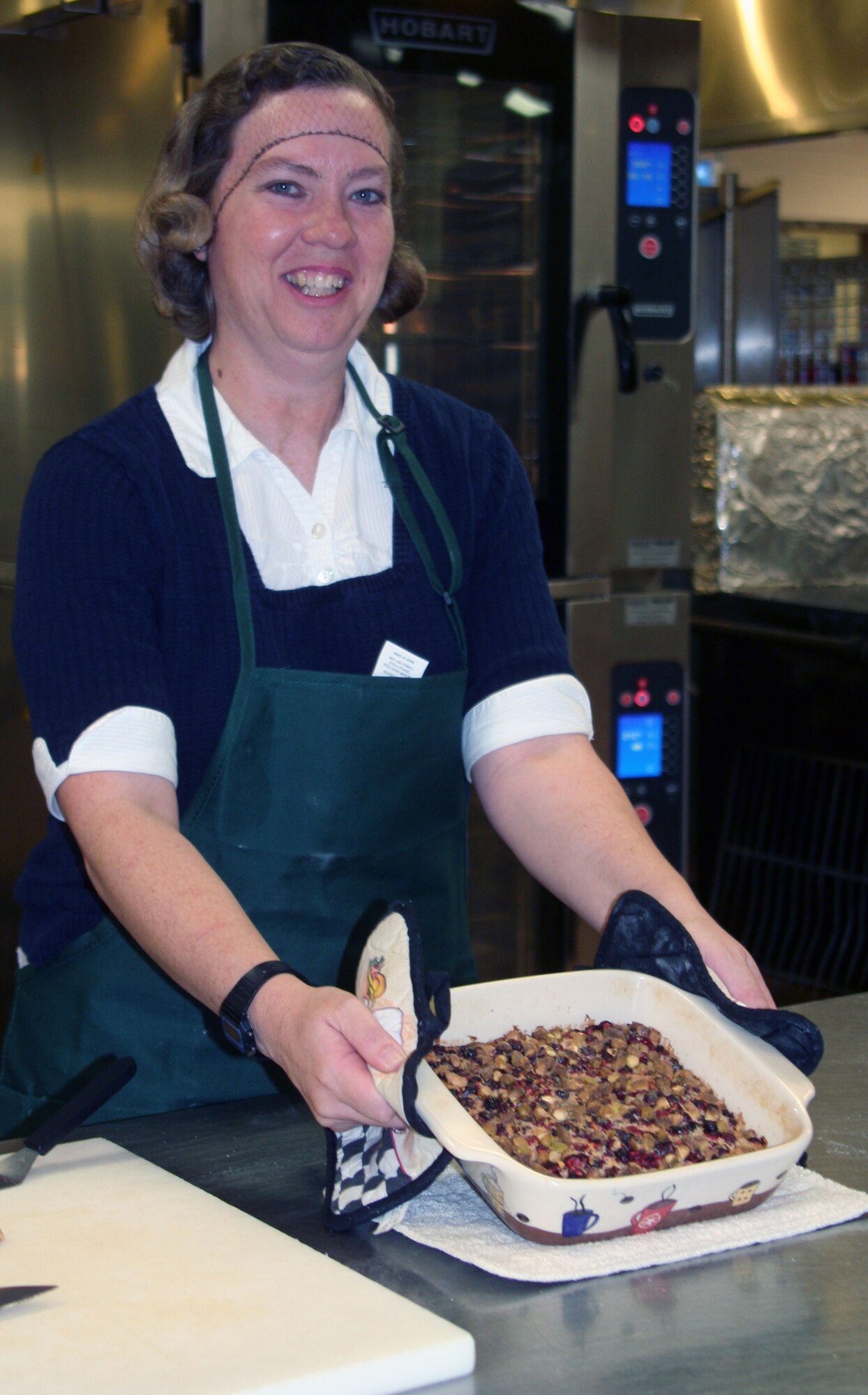 WRIGHT-PATTERSON AIR FORCE BASE, Ohio – Stacy Vaughn, 445th Airlift Wing Public Affairs, displays her holiday cranberry-orange pistachio bars for the 3rd Annual Wright-Patt Culinary Competition on Nov. 3 at the Wright-Patterson Air Force Base hospital dining room. Judges tasted four health holiday dishes that met the specific guidelines for a healthy, holiday dessert. (U.S. Air Force photo/Susan Belna)