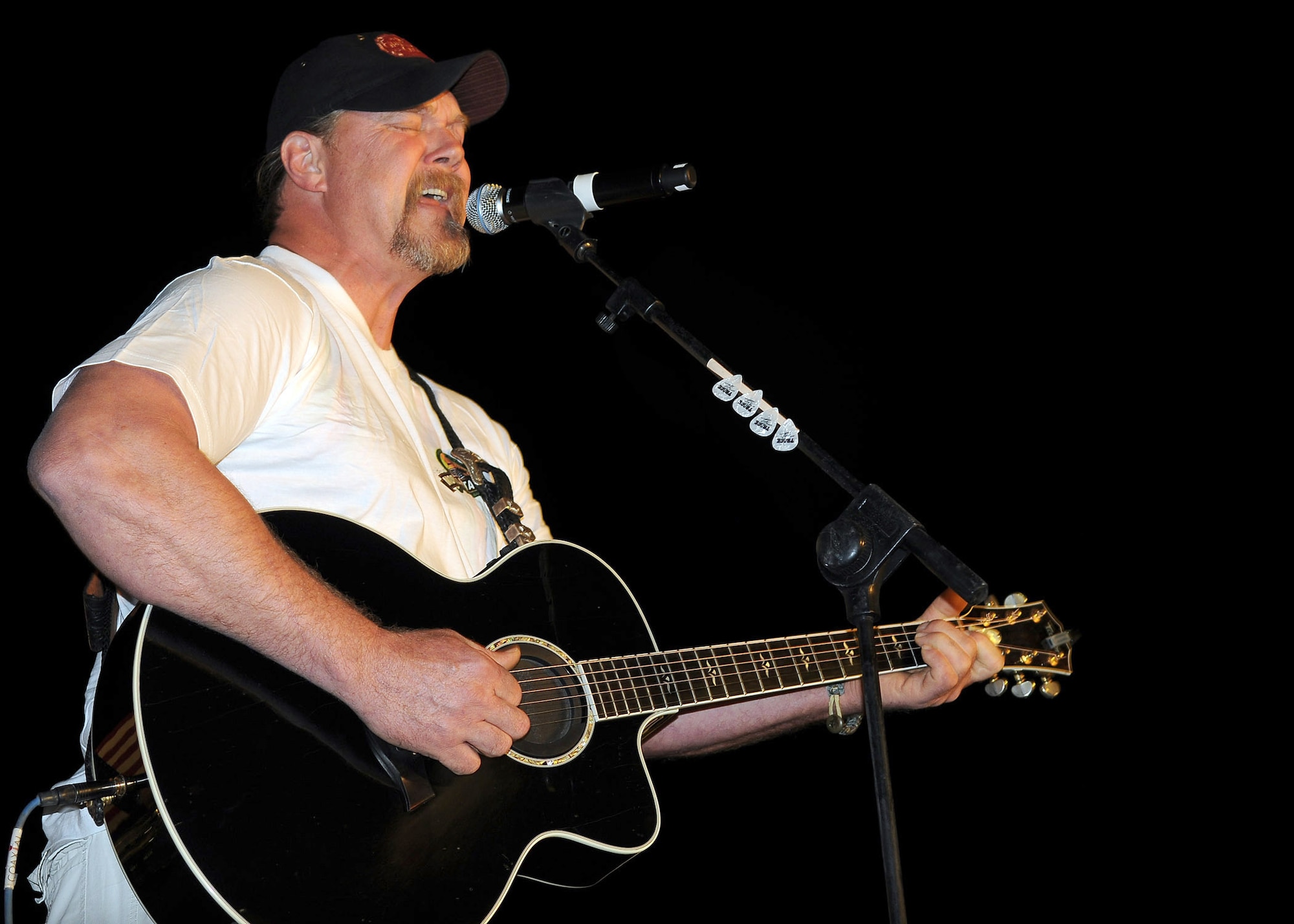 Country music artist Trace Adkins performs for servicemembers and civilians Nov. 2, 2010, at Joint Base Balad, Iraq, during his USO tour. (U.S. Air Force photo/Senior Airman Marianne E. Lane)