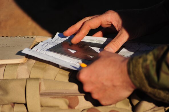 DAVIS-MONTHAN AIR FORCE BASE, Ariz. - Navigating over rough terrain is just one of the many jobs the Active Duty and Reserve pararescuemen were required to do during the PJ Rodeo in Tucson Ariz. Eight PJ teams were required to navigate through the hot desert for a simulated rescue mission. These events during the competition consisted of free-fall parachuting, shooting, combat movements, combat medical and navigation. (U.S. Air Force photo/Airman First Class Jerilyn Quintanilla)