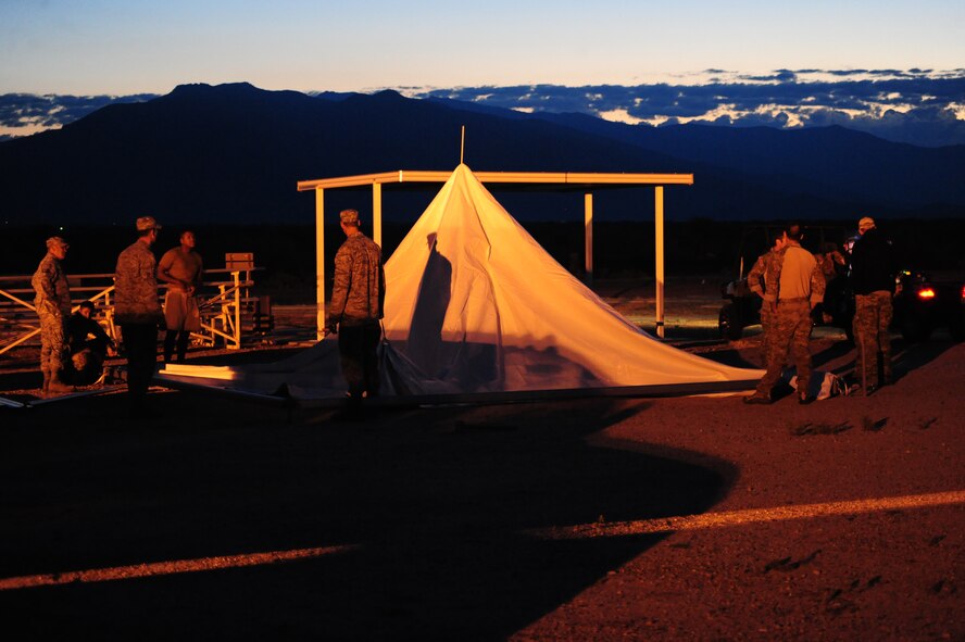 DAVIS-MONTHAN AIR FORCE BASE, Ariz. - Setting up camp and then navigating over rough terrain was just one of the many jobs the Active Duty and Reserve pararescuemen were required to do during the PJ Rodeo in Tucson Ariz. The events during the competition consisted of free-fall parachuting, shooting, combat movements, combat medical and navigation. (U.S. Air Force photo/Airman First Class Jerilyn Quintanilla)