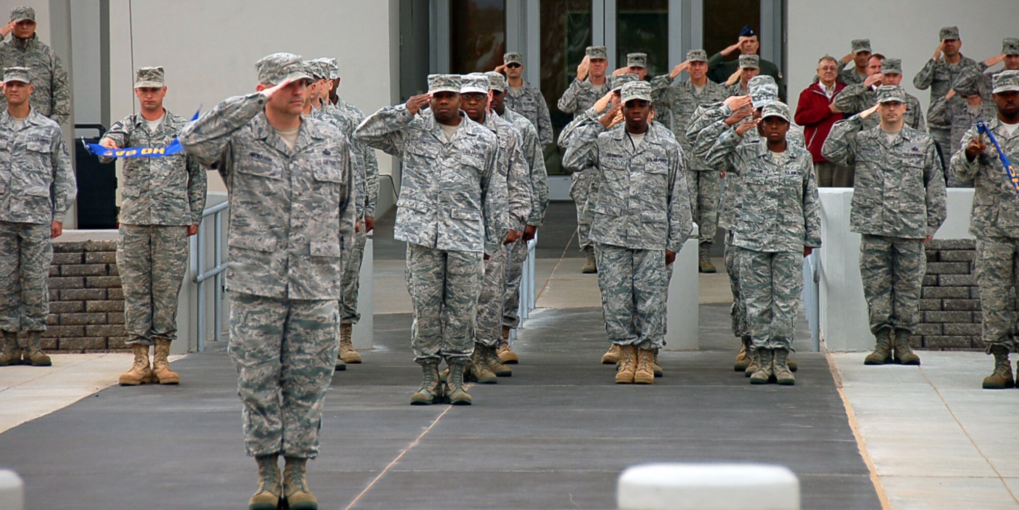 BOSSIER CITY, La. - Members of Headquarters Eighth Air Force salute the U.S. flag during a retreat ceremony at the Cyber Innovation Center in Bossier City, La., Nov. 3, 2010, to commemorate the day in Eighth Air Force history. On Nov. 3, 1943, Eighth Air Force dispatched more than 500 B-17 Flying Fortresses and B-24 Liberators to Wilhelmshaven, a German port along the North Sea, with the primary mission of striking U-boat construction yards in the area. This was the first “500 bomber strike” conducted by Eighth Air Force and the mission showcased the growing air power of the “Mighty Eighth” and highlighted its innovation spirit in employing new technology in combat. (U.S. Air Force photo by Staff Sgt. Brian Stives)