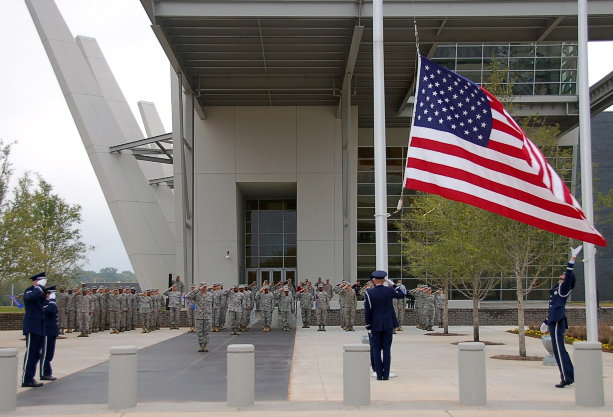 BOSSIER CITY, La. - Members of the 2nd Bomb Wing Honor Guard from Barksdale Air Force Base, La., lower the U.S. flag during a Headquarters Eighth Air Force retreat ceremony at the Cyber Innovation Center in Bossier City, La., Nov. 3, 2010, to commemorate the day in Eighth Air Force history. On Nov. 3, 1943, Eighth Air Force dispatched more than 500 B-17 Flying Fortresses and B-24 Liberators to Wilhelmshaven, a German port along the North Sea, with the primary mission of striking U-boat construction yards in the area. This was the first “500 bomber strike” conducted by Eighth Air Force and the mission showcased the growing air power of the “Mighty Eighth” and highlighted its innovation spirit in employing new technology in combat. (U.S. Air Force photo by Staff Sgt. Brian Stives)