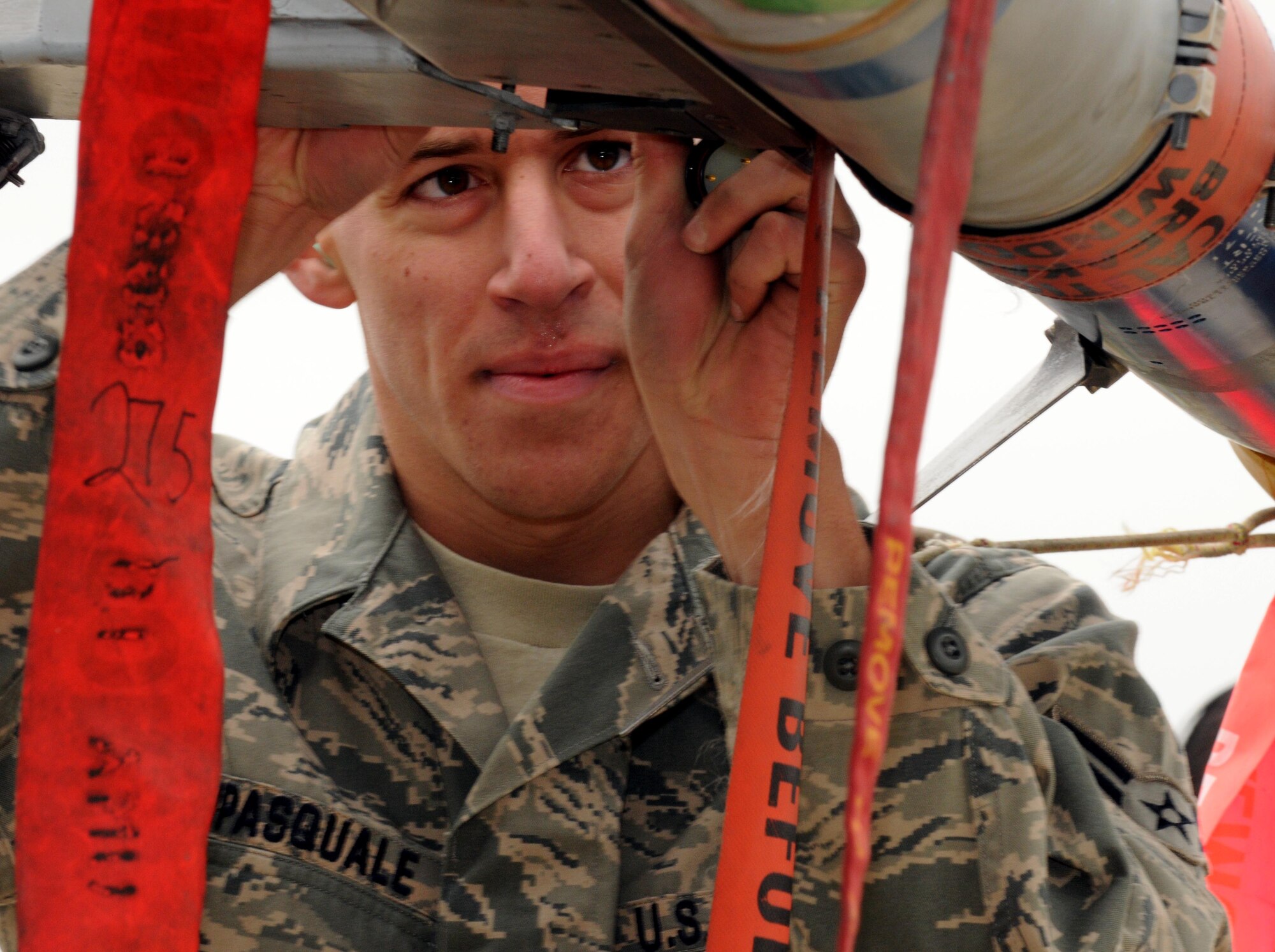 SPANGDAHLEM AIR BASE, Germany – Airman 1st Class Samuel Dipasquale 52nd Aircraft Maintenance Squadron weapons load crew member, secures an AIM-9 L/M missile to the wing of an A-10 Thunderbolt II during the load crew of the quarter competition Nov. 2. The 480th Fighter Squadron load crew competed against the 81st Fighter Squadron load crew to determine the winner that will advance to compete for load crew of the year. (U.S. Air Force photo/Airman 1st Class Matthew B. Fredericks)