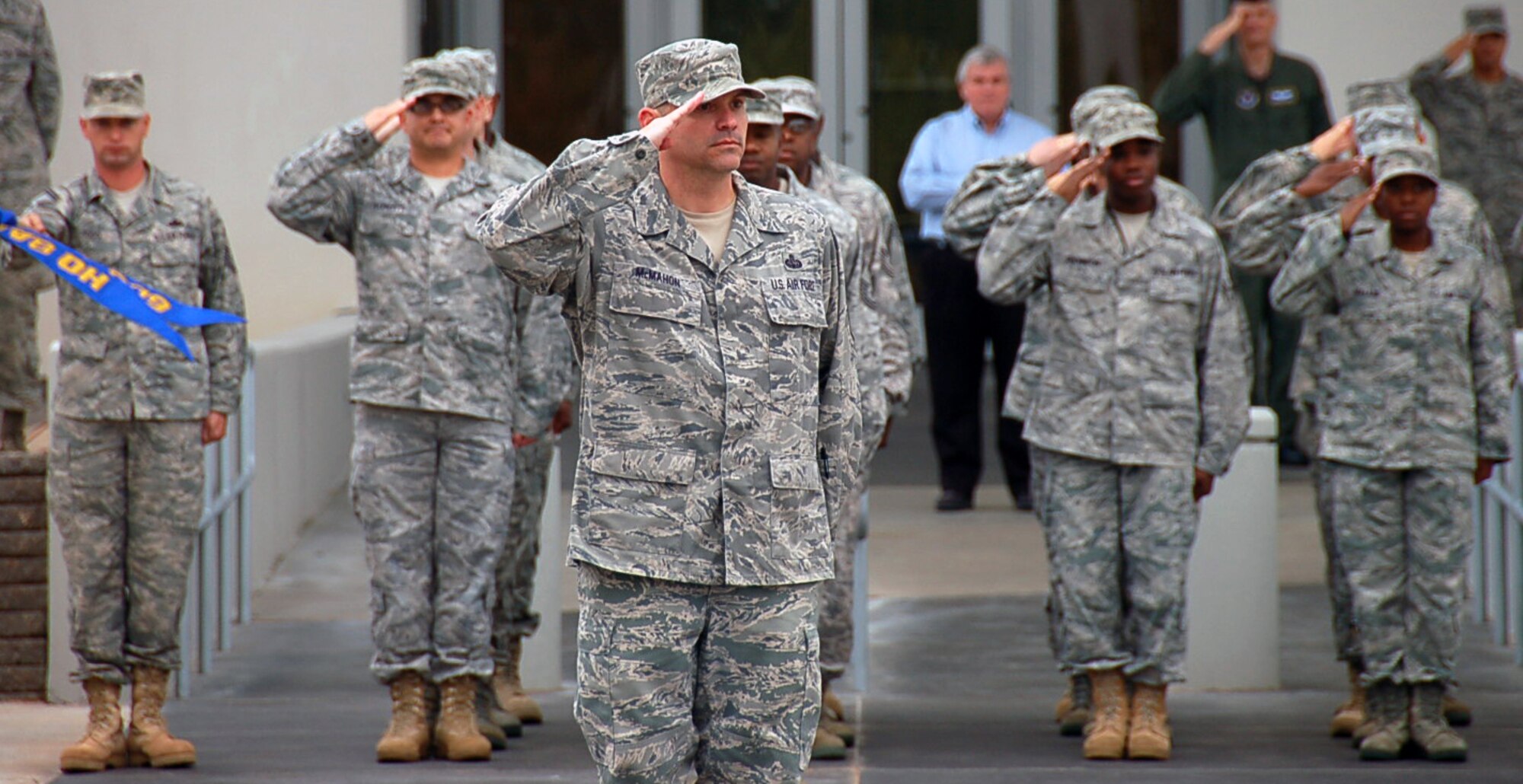 BOSSIER CITY, La. - Chief Master Sgt. Patrick McMahon, Eighth Air Force acting command chief, salutes the U.S. flag during a retreat ceremony at the Cyber Innovation Center in Bossier City, La., Nov. 3, 2010, to commemorate the day in Eighth Air Force history. On Nov. 3, 1943, Eighth Air Force dispatched more than 500 B-17 Flying Fortresses and B-24 Liberators to Wilhelmshaven, a German port along the North Sea, with the primary mission of striking U-boat construction yards in the area. This was the first “500 bomber strike” conducted by Eighth Air Force and the mission showcased the growing air power of the “Mighty Eighth” and highlighted its innovation spirit in employing new technology in combat. (U.S. Air Force photo by Staff Sgt. Brian Stives)