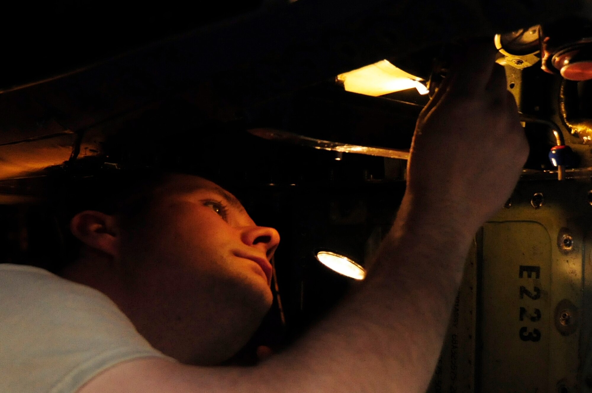 ROYAL AIR FORCE LAKENHEATH, England--Staff Sgt. Shane Mitchell, 48th Equipment Maintenance Squadron dock chief, inspection an F15 at Hangar 7 Nov. 3. Sergeant Mitchell was nominated for a liberty spotlight because he displays the core value 'Excellence in All We Do'. (U.S. Air Force photo/Airman 1st Class Eboni Knox)