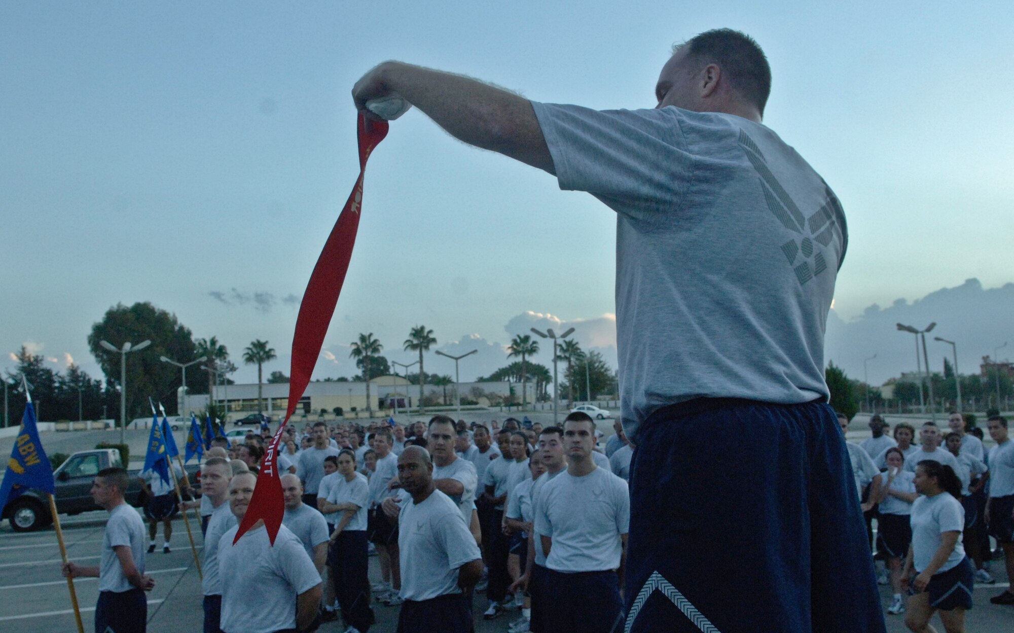 Col. Eric Beene, the 39th Air Base Wing commander, encourages squadrons to show their spirit after a monthly wing run to promote the That Guy campaign Oct. 29, 2010 Incirlik Air Base, Turkey. That Guy campaign, funded by the Department of Defense, is designed to reduce alcohol abuse and to raise awareness of the negative short-term social consequences of excessive drinking to young servicemen. (U.S. Air Force photo by Senior Airman Alexandre Montes/Released)
