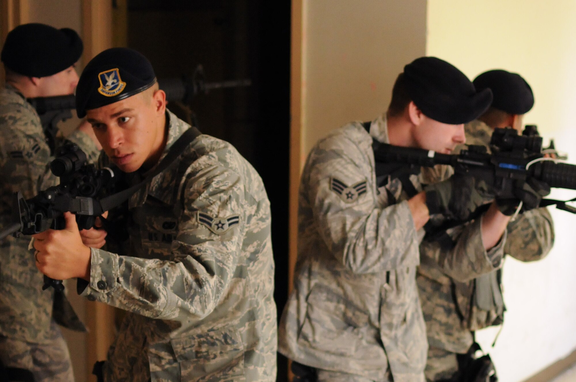 Airmen from the 102nd Security Forces Squadron conduct a training session at Dever State School in Taunton, Mass., Oct. 2, 2010. The Airmen learned how to handle a situation involving a suspect who is actively moving about and shooting at people within a building.  (U.S. Air Force photo by Master Sgt. Aaron Smith)