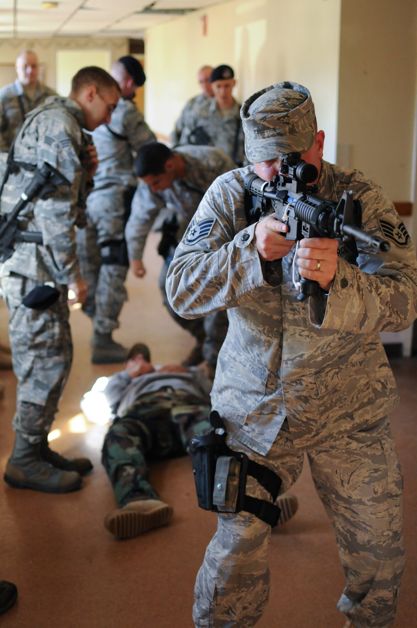 Airmen from the 102nd Security Forces Squadron conduct a training session at Dever State School in Taunton, Mass., Oct. 2, 2010. The Airmen learned how to handle a situation involving a suspect who is actively moving about and shooting at people within a building.  (U.S. Air Force photo by Master Sgt. Aaron Smith)
