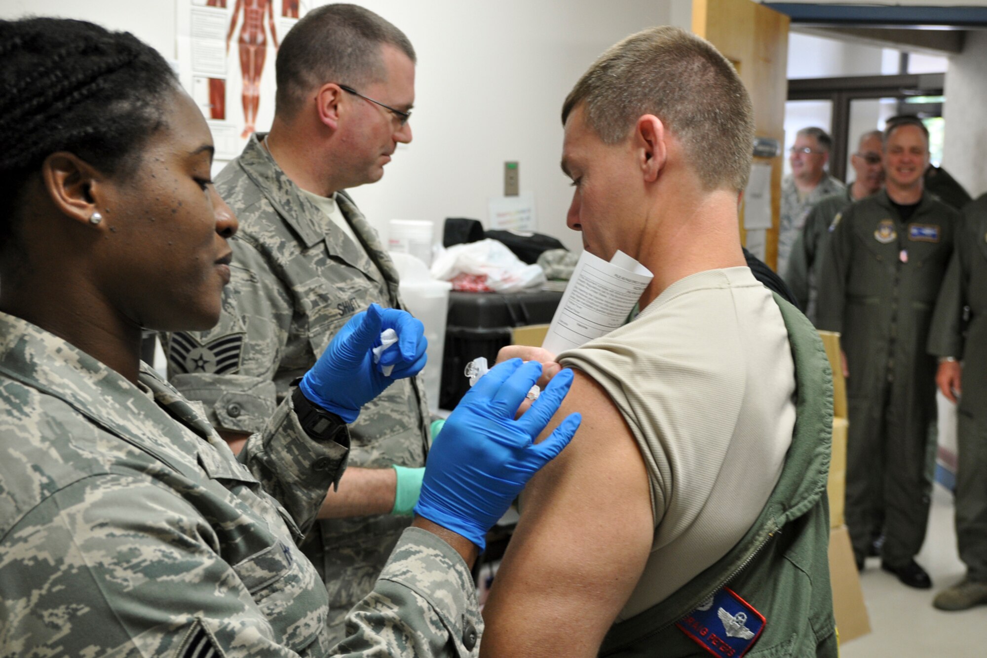 Tech. Sgt. Kimelyn Hill, aeromedical technician with 910th Medical Squadron, administers an influenza vaccine to Col. Craig C. Peters, 910th Operations Group commander, Sept. 11. Unit supervisors will be notified during the October Unit Training Assembly with details pertaining to the time and location for the Reservists within their unit to receive the required vaccine. For more information, contact MDS at 330-609-1233.