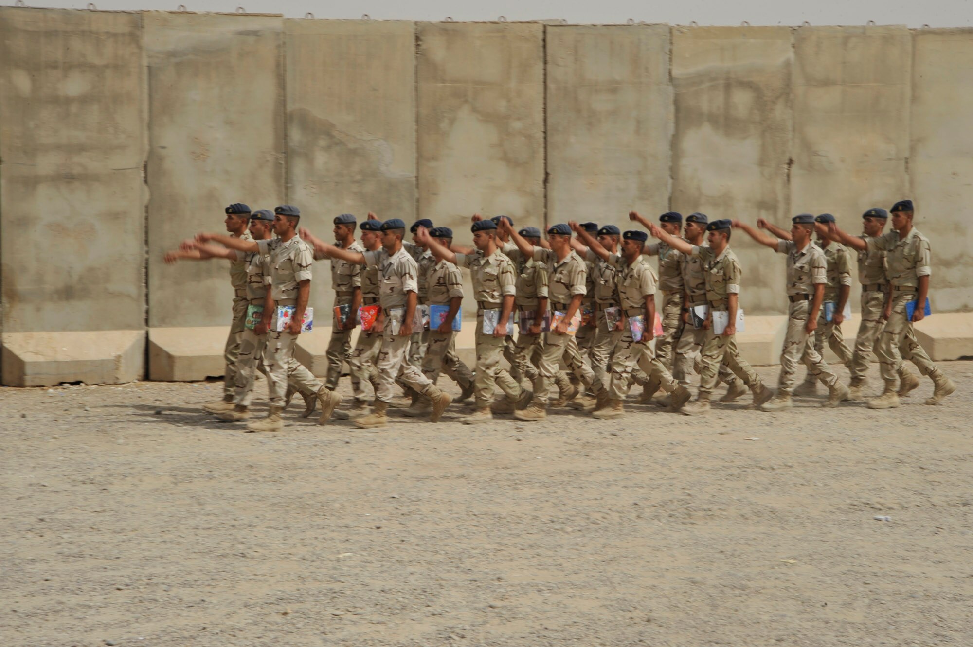 Iraqi Air Force College cadets march to lunch, Sept. 25, cadets are learning subjects like aviation theory, electronic instruments, weather forecasting , English and more at Tikrit Air Base, Iraq. Cadets at the school are studying to become pilots in the Iraqi air force. Ground support officer training is conducted at Taji AB until Tikrit has the infrastructure to support more cadets. The college reopened Sept. 1 when Iraqi air force cadets returned after temporarily operating jointly with the Iraqi army in Ar Rustamiyah since February 2007. (U.S. Air Force photo by Senior Airman Perry Aston) (Released)