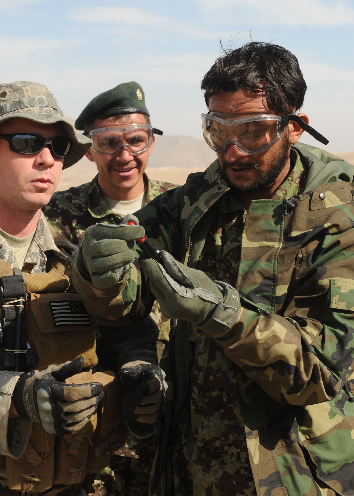 101103-N-6541W-061 KABUL, Afghanistan - Afghan Air Force Life Support Personnel practice using signaling devices. They will begin teaching this life saving skill to Afghan Afghan Air Force pilots so they know how to signal for rescue. (Mass Communication Specialist 3rd Class Jared Walker/ RELEASED).