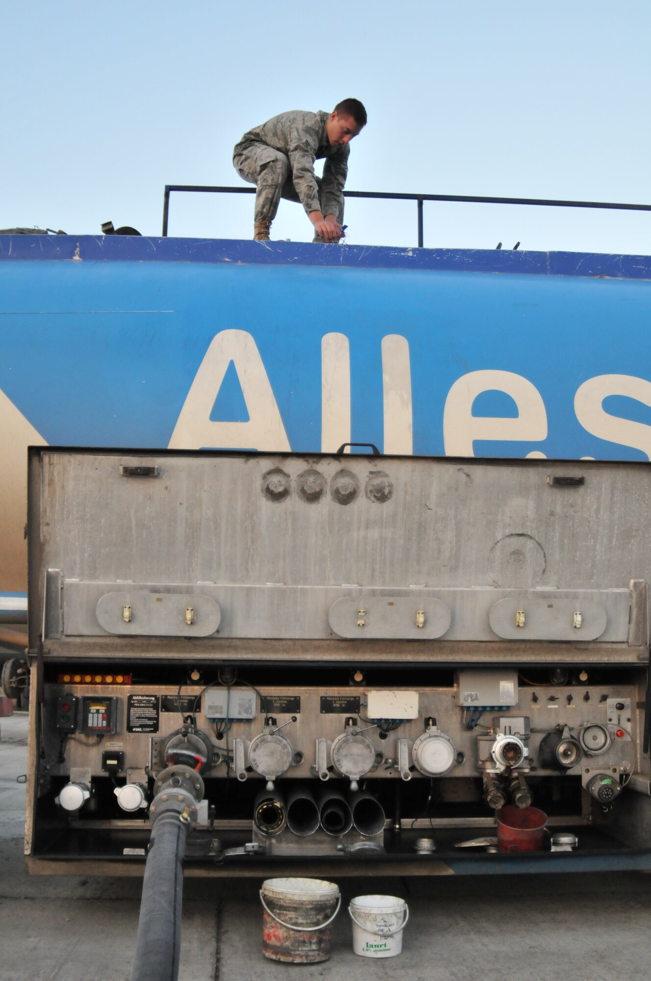 CAMPIA TURZII AIR BASE, Romania – Airman 1st Class Adam Saukulak, 48th Logistics Readiness Squadron fuels distribution operator, checks seals on a tanker truck delivering aviation fuel Oct. 29. The seals are to guard against tampering with the fuel intended for aircraft participating in Operation Golden Lance. (U.S. Air Force photo/Senior Airman David Dobrydney)