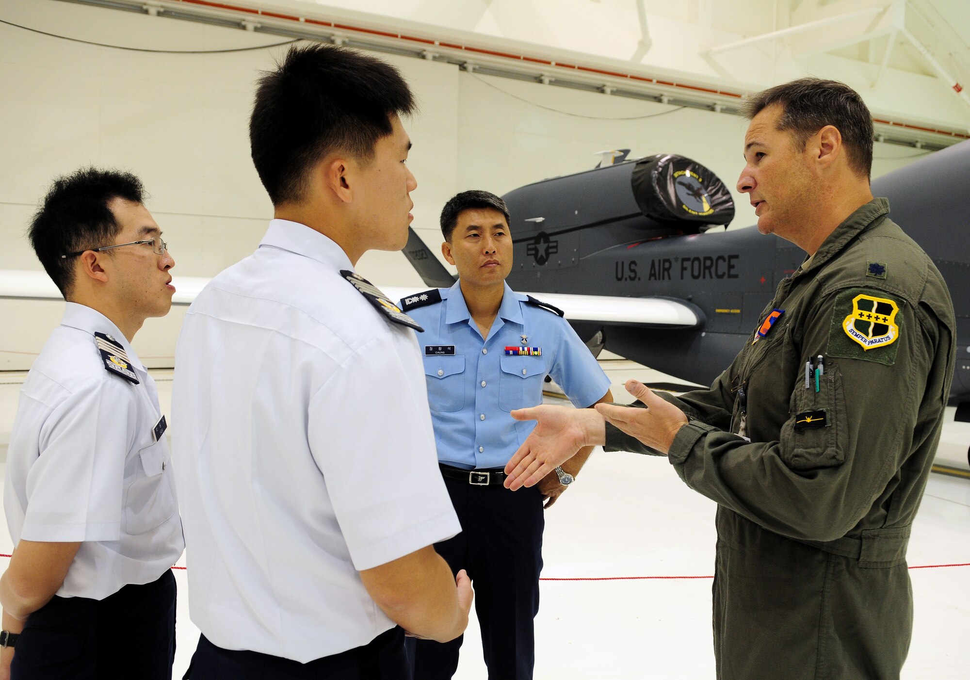 A U.S. Air Force lieutenant colonel from the 9th Operations Group, Detachment 3, speaks to more than 60 Republic of Korea Air Force Academy Cadets and 18 Officers about the RQ-4 Global Hawk aircraft and its unique mission at Andersen Air Force Base during a tour here Nov. 4.  The purpose of their visit here and Joint Region Marianas Naval Base Guam was to promote and strengthen the close ties between the allied nations. (U.S. Air Force photo/ Senior Airman Nichelle Anderson)