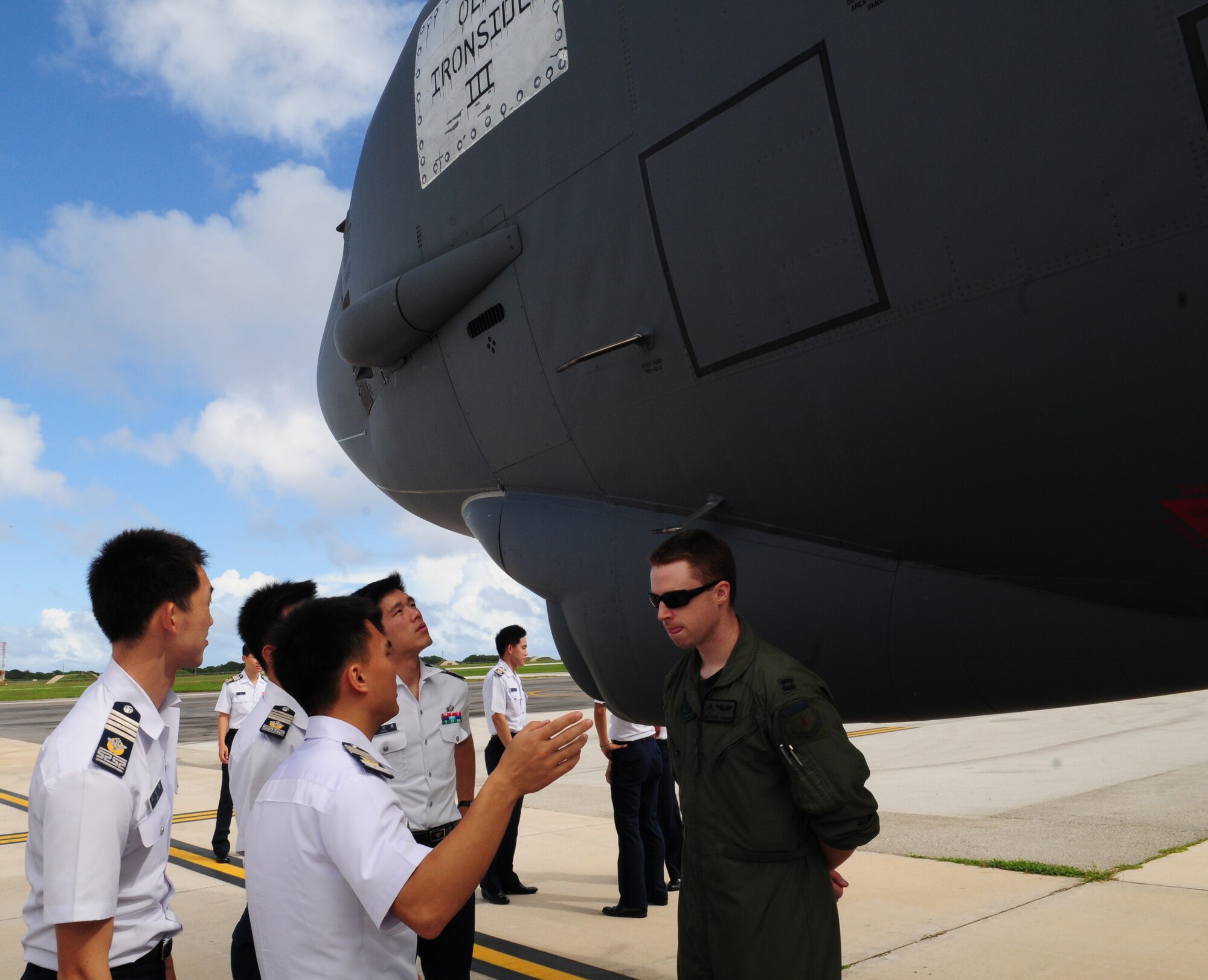A Republic of Korea Air Force cadets asks Capt. Matthew Johnson, 23d Expeditionary Bomb Squadron B-52 Stratofortress radar navigator, about the unique capabilities of the B-52 Stratofortress during a visit to Andersen Air Force Base, Guam, Nov. 4. During their visit here the ROKAF Cadets viewed a static display of a U.S. Air Force B-52 Stratofortress aircraft and the RQ-4 Global Hawk. The purpose of the visit was to promote and strengthen the close ties between the allied nations. (U.S. Air Force photo/ Senior Airman Nichelle Anderson)