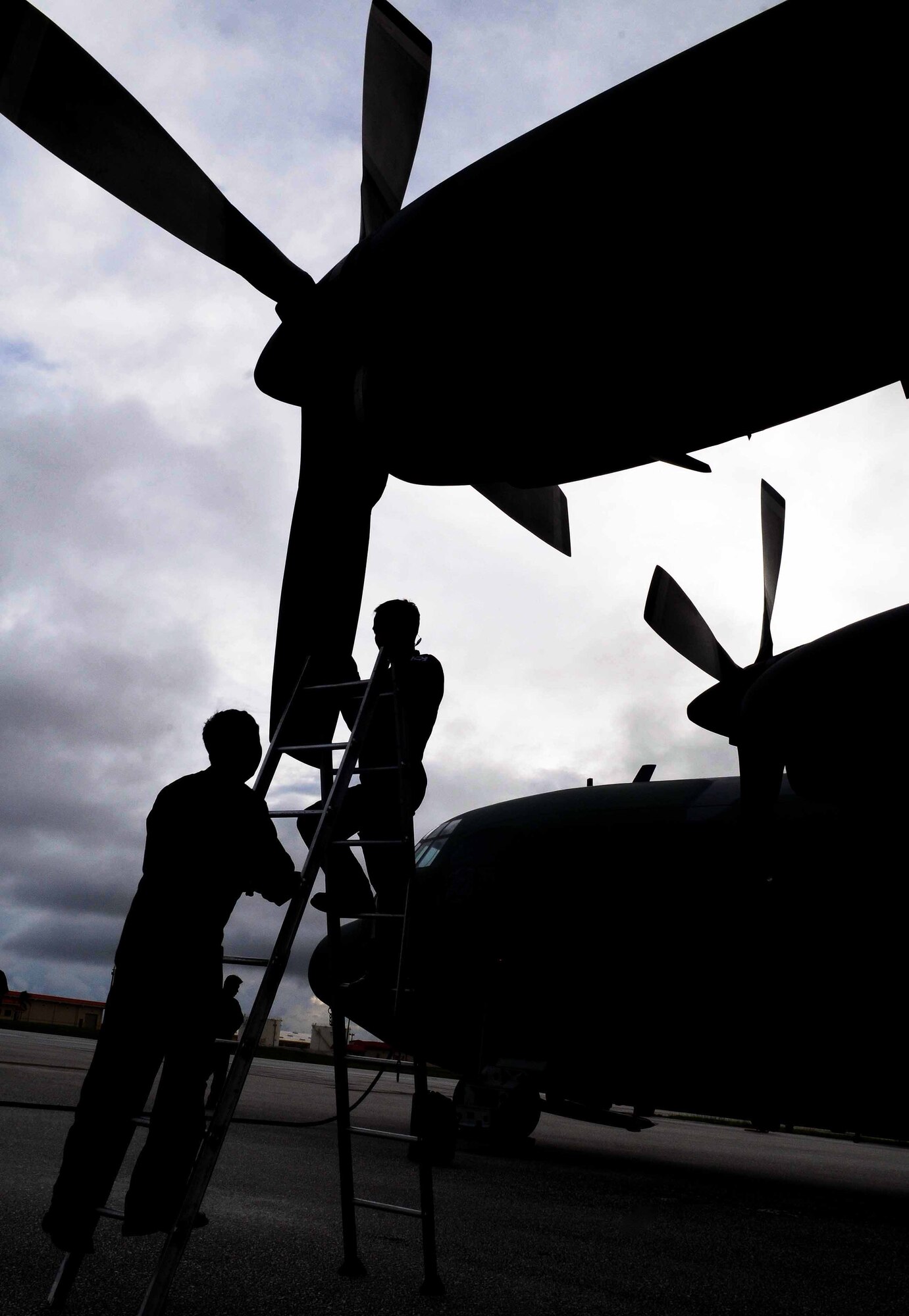 Republic of Korea Air Force aircraft maintainers perform routine maintenance on a ROKAF C-130 aircraft after arriving to Andersen Air Force Base, Guam, Nov. 2. The purpose of the visit was to promote and strengthen the close ties between the allied nations. (U.S. Air Force photo/ Senior Airman Nichelle Anderson/Released)
