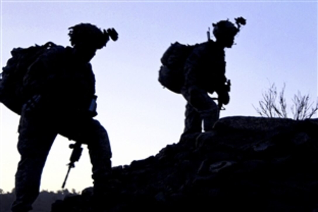 U.S. Army soldiers walk up the side of a mountain during the early morning hours in the Charbaran district of Afghanistan's Paktia province, Oct. 27, 2010. The soldiers, assigned to the 101st Airborne Division's Company E, 2nd Battalion, 506th Infantry Regiment, 4th Brigade Combat Team, were part of the largest combined air assault mission the combat team has conducted this year in the province.