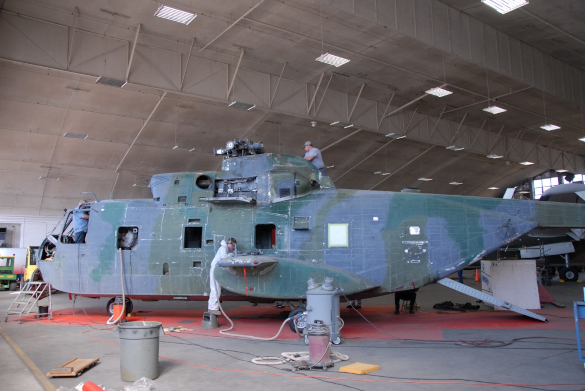 DAYTON, Ohio - Historic HH-3 "Jolly Green" undergoing restoration work at the National Museum of the U.S. Air Force. (U.S. Air Force Photo)