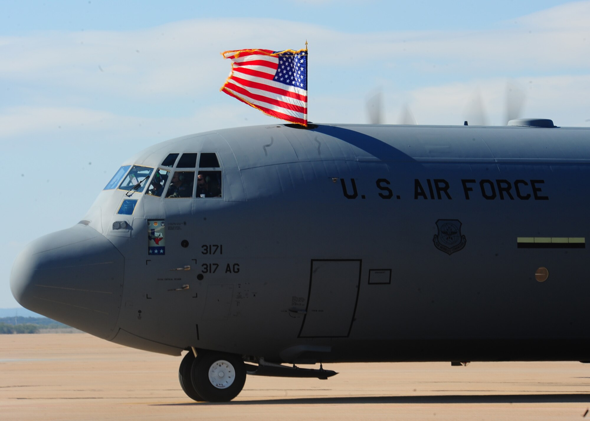DYESS AIR FORCE BASE, Texas – A C-130 J model aircraft taxis down the runway here, Nov. 2. “Whether we’re bringing aid to flood victims in Pakistan, supporting our nation’s homeland defense, or air dropping critical supplies to forward units in Afghanistan, we will put this aircraft and the 26 others that follow to the test,” said Col. Dan Dagher, 317 AG commander. “Today marks the day where the capability of the 317 AG, Air Mobility Command and the Air Force has significantly increased, and starts another 49 years of C-130 presence in Abilene.” 
