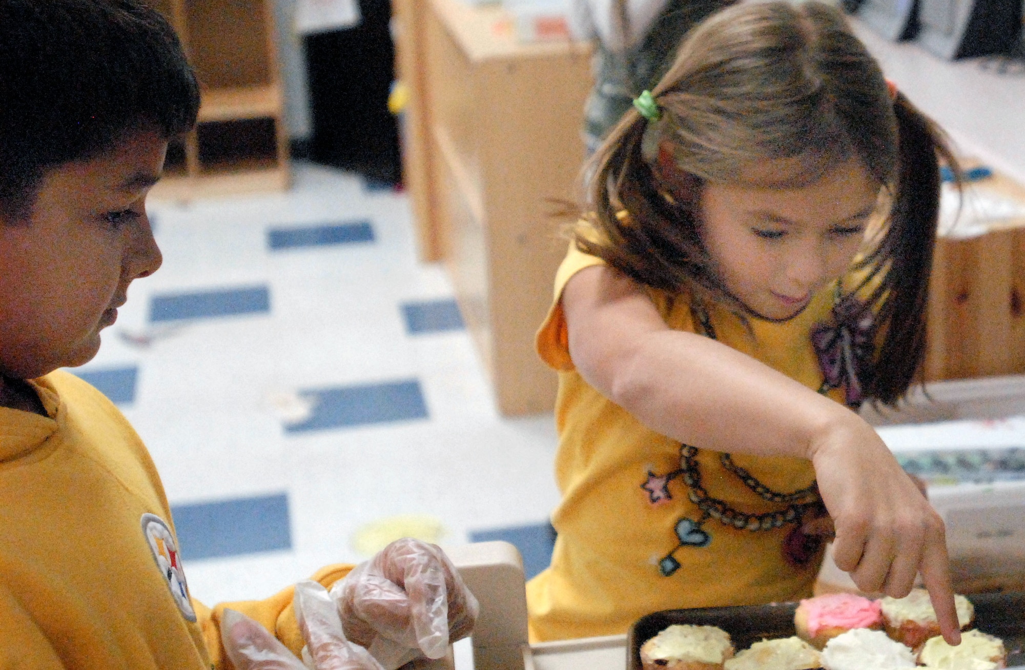 GOODFELLOW AIR FORCE BASE, Texas - Cake walk winner, Daisy Herr, 8, picks out her cupcake during the Kids Fall Festival at the School Age Center Nov. 4. Military youths from the School Age and Youth Center organized and ran all the games held at this year's event. (U.S. Air Force photo/Connie Hempel)