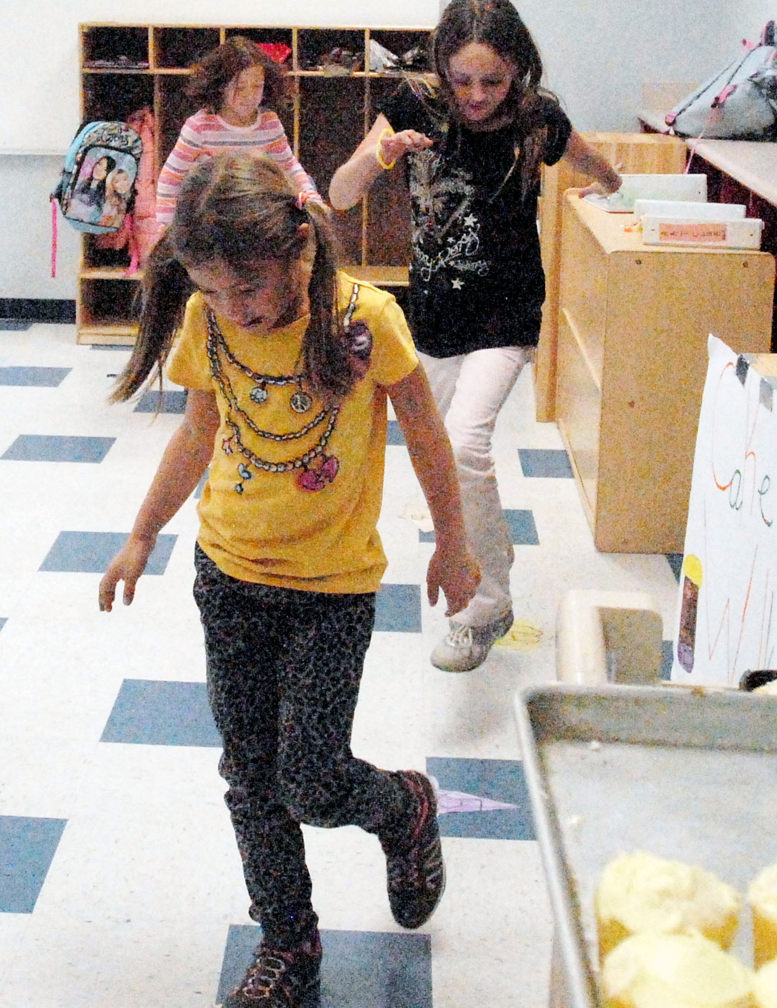 GOODFELLOW AIR FORCE BASE, Texas - Youths from the School Age and Youth Center do a cake walk during the Kids Fall Festival at the School Age Center Nov. 4. Military youths from both programs organized and ran all the games held at this year's event. (U.S. Air Force photo/Connie Hempel)