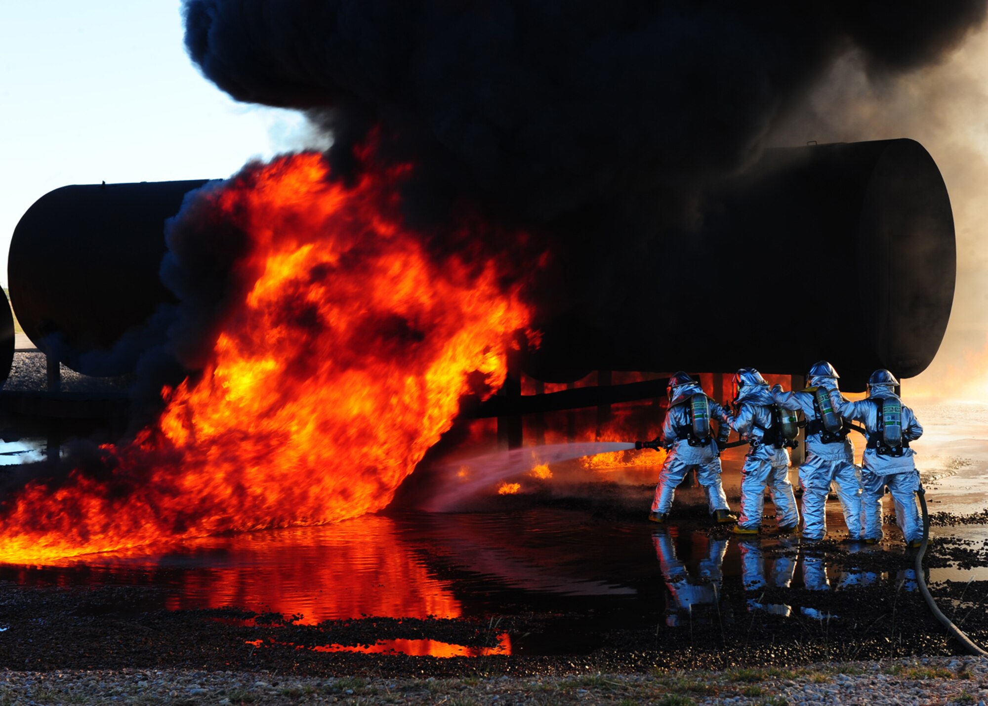 DYESS AIR FORCE BASE, Texas –Dyess and Abilene Regional airport (ABI) firefighters team up to extinguish an aircraft fire during a joint training exercise here Nov 5. Firefighters from ABI are required by the Federal Aviation Association (FAA) to be proficient in extinguishing aircraft fires. By inviting them onto the base, Dyess firefighters facilitate a means to achieve their annual training and foster a working  relationship.(U.S. Air Force Photo/Airman 1st Class Chelsea Cummings)