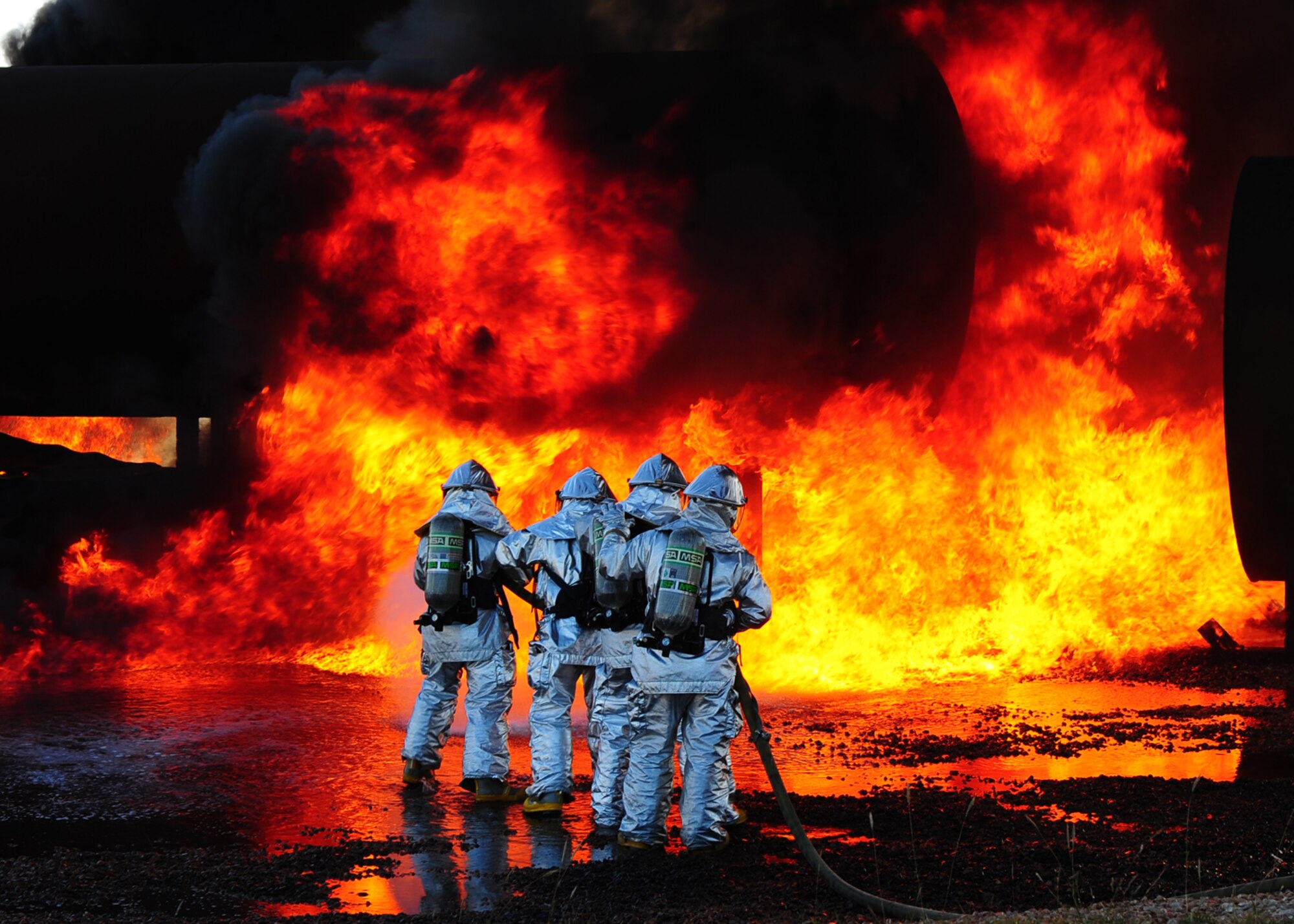 DYESS AIR FORCE BASE, Texas –Dyess and Abilene Regional airport (ABI) firefighters team up to extinguish an aircraft fire during a joint training exercise here Nov 5. Firefighters from ABI are required by the Federal Aviation Association (FAA) to be proficient in extinguishing aircraft fires. By inviting them onto the base, Dyess firefighters facilitate a means to achieve their annual training and foster a working  relationship.(U.S. Air Force Photo/Airman 1st Class Chelsea Cummings)