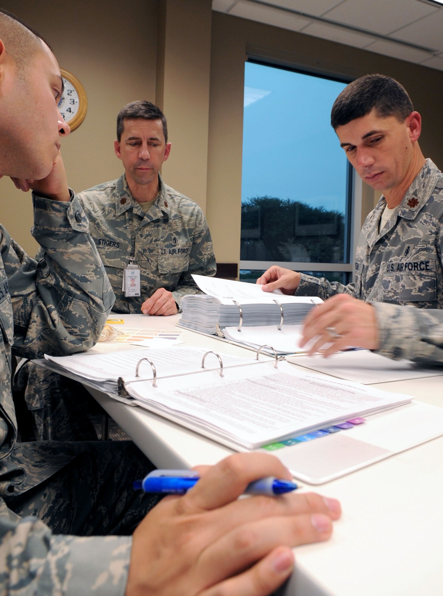 BARKSDALE AIR FORCE BASE, La. ? Maj. David Webb, 2nd Medical Support Squadron Medical Logistics Flight Commander, and 2nd Lt. Matthew Trevino, 2 MDSS director patient administrator, reviews Maj. Jim Stigers, 2nd Aerospace Medical Squadron Public Health Flight commander, programs and processes in preparation for the Health Services Inspection in the education training center room Nov. 3. (U.S. Air Force photo/Senior Airman La?Shanette V. Garrett)(RELEASED)
