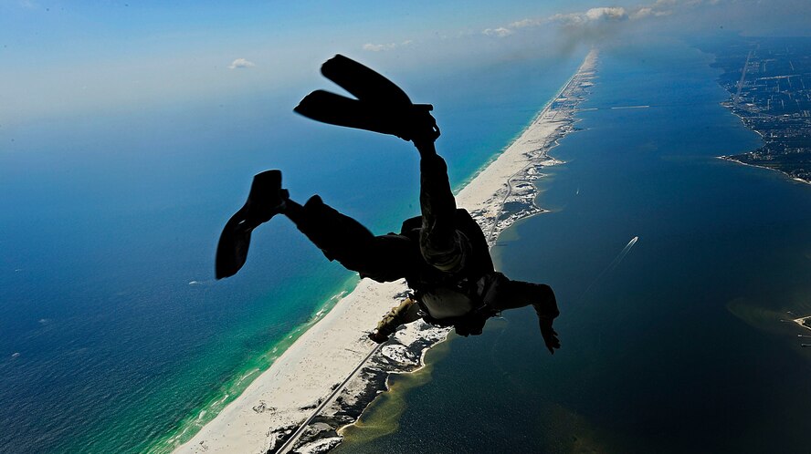 U.S. Air Force members from the 23rd Special Tactics Squadron, Air Force Special Operations Command, Hurlburt Field, Fla., jump out of the back of a C-130 Hercules Sept. 27, 2010. The airmen will practice combat operations in the Santa Rosa Sound. (U.S. Air Force Photo by Master Sgt. Russell E Cooley IV/Released)