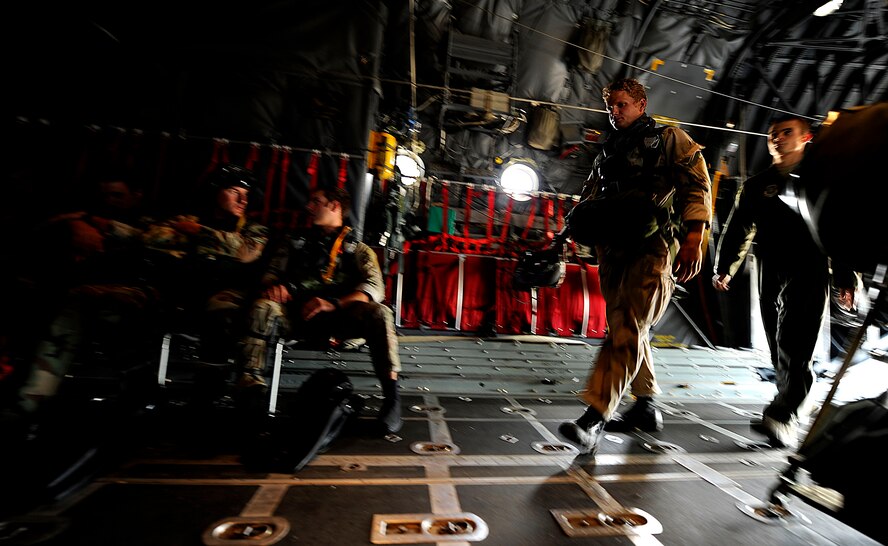 U.S. Air Force members from the 23rd Special Tactics Squadron, Air Force Special Operations Command, Hurlburt Field, Fla., wait to jump out of the back of a C-130 Hercules Sept. 27, 2010. The airmen will practice combat operations in the Santa Rosa Sound. (U.S. Air Force Photo by Master Sgt. Russell E Cooley IV/Released)