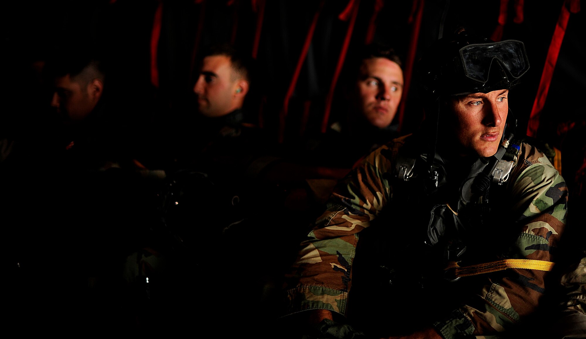U.S. Air Force members from the 23rd Special Tactics Squadron, Air Force Special Operations Command, Hurlburt Field, Fla., look out the back of a C-130 Hercules Sept. 27, 2010. The airmen will practice combat operations in the Santa Rosa Sound. (U.S. Air Force Photo by Master Sgt. Russell E Cooley IV/Released)