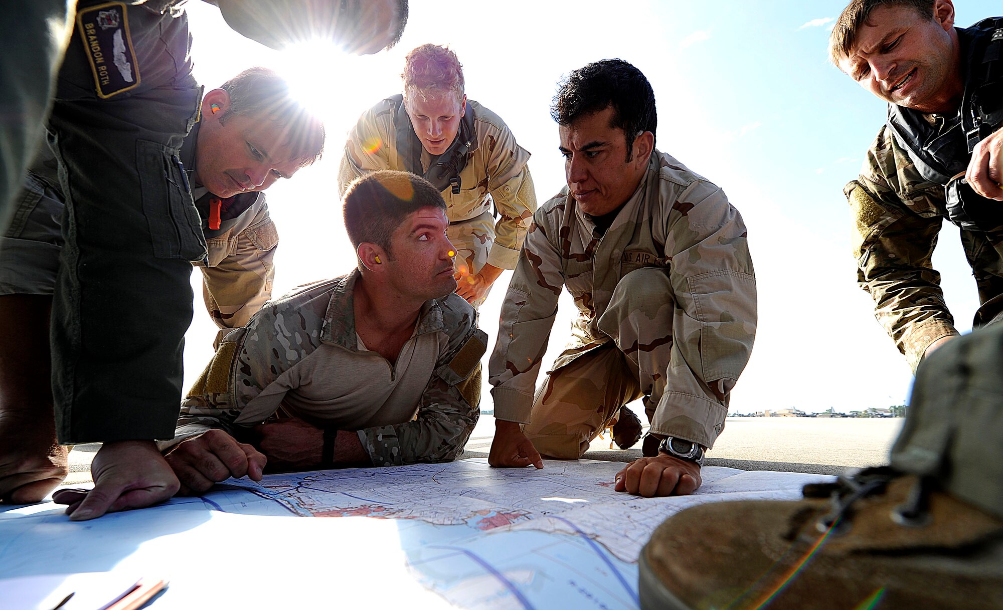 U.S. Air Force members from the 23rd Special Tactics Squadron, Air Force Special Operations Command, go over drop zones and proper flight paths at Hurlburt Field, Fla., Sept. 27, 2010. The airmen will practice combat operations in the Santa Rosa Sound. (U.S. Air Force Photo by Master Sgt. Russell E Cooley IV/Released)