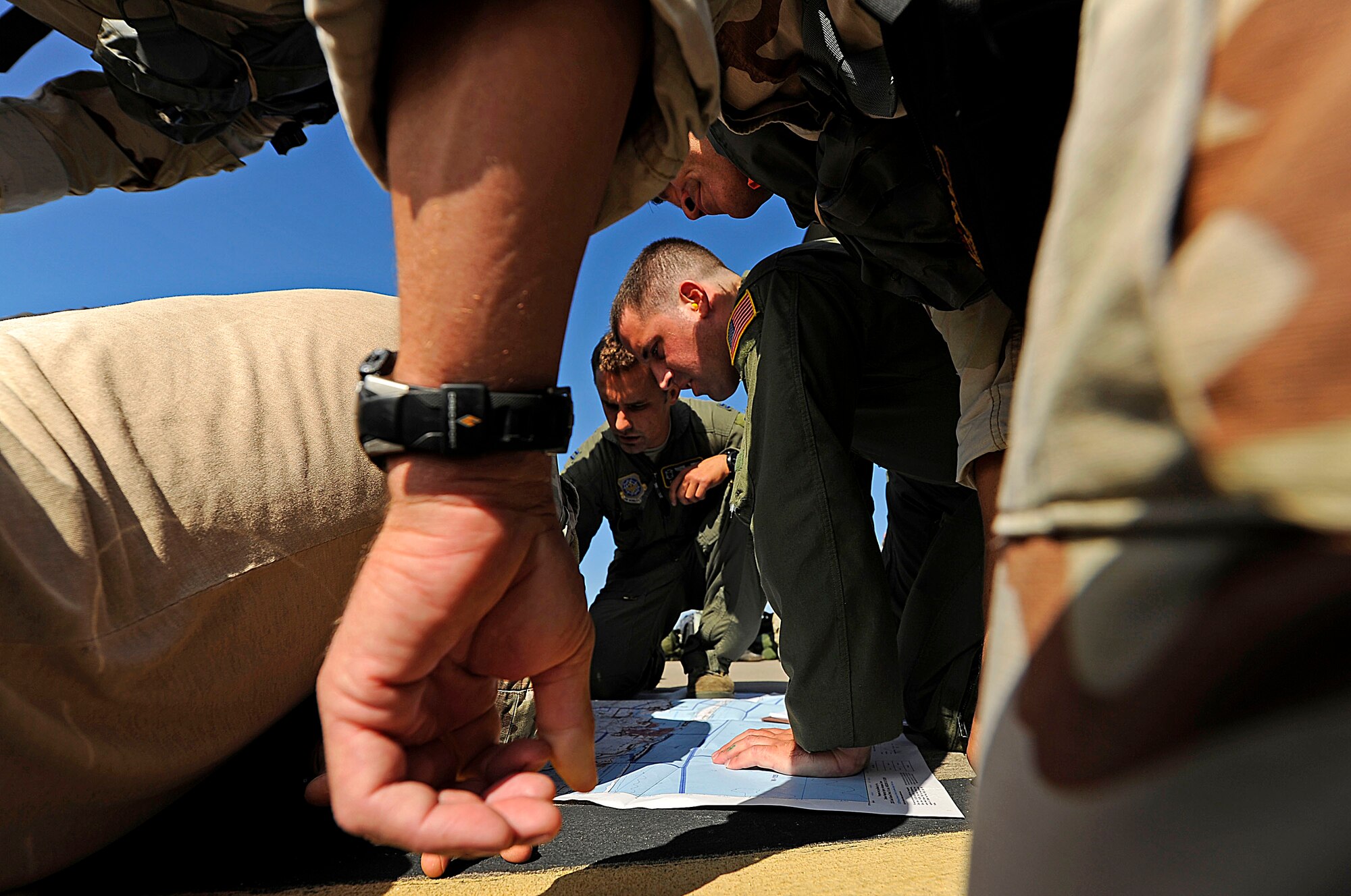 U.S. Air Force members from the 23rd Special Tactics Squadron, Air Force Special Operations Command, go over drop zones and proper flight paths at Hurlburt Field, Fla., Sept. 27, 2010. The airmen will practice combat operations in the Santa Rosa Sound. (U.S. Air Force Photo by Master Sgt. Russell E Cooley IV/Released)