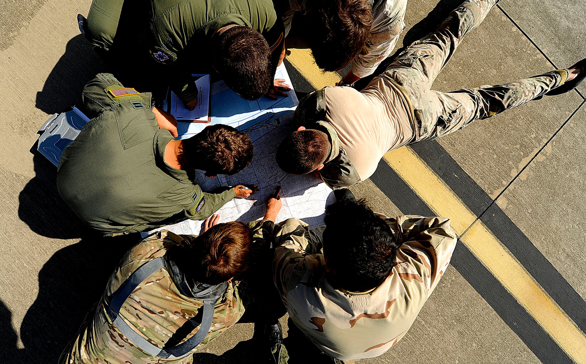 U.S. Air Force members from the 23rd Special Tactics Squadron, Air Force Special Operations Command, go over drop zones and proper flight paths at Hurlburt Field, Fla., Sept. 27, 2010. The airmen will practice combat operations in the Santa Rosa Sound. (U.S. Air Force Photo by Master Sgt. Russell E Cooley IV/Released)