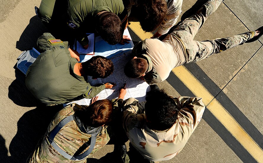 U.S. Air Force members from the 23rd Special Tactics Squadron, Air Force Special Operations Command, go over drop zones and proper flight paths at Hurlburt Field, Fla., Sept. 27, 2010. The airmen will practice combat operations in the Santa Rosa Sound. (U.S. Air Force Photo by Master Sgt. Russell E Cooley IV/Released)