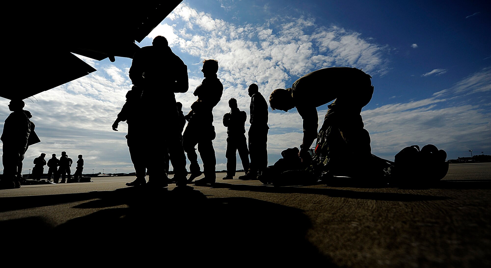 U.S. Air Force members from the 23rd Special Tactics Squadron, Air Force Special Operations Command, wait to board a C-130 Hercules at Hurlburt Field, Fla., Sept. 27, 2010. The airmen will practice combat operations in the Santa Rosa Sound. (U.S. Air Force Photo by Master Sgt. Russell E Cooley IV/Released)