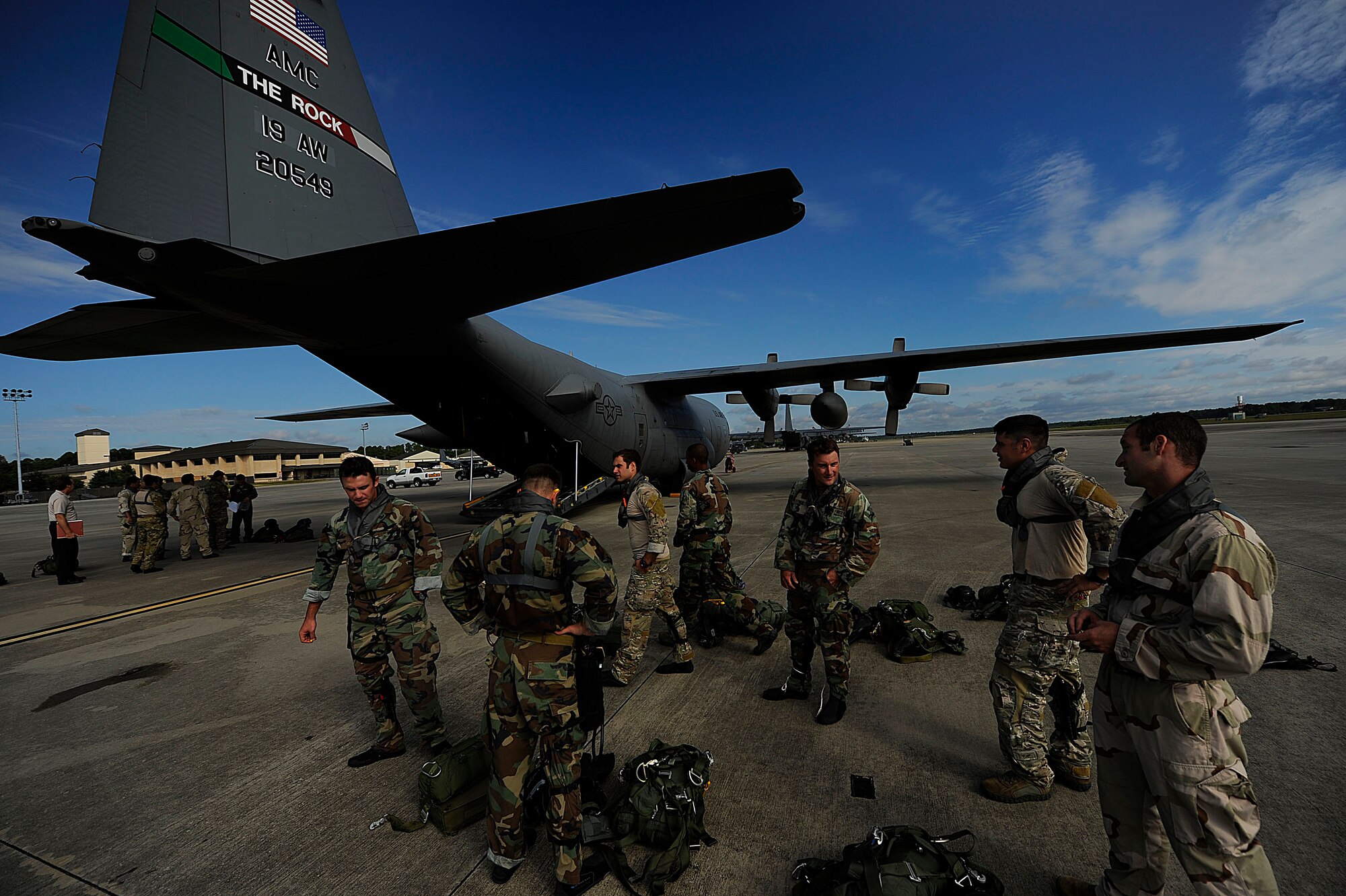 U.S. Air Force members from the 23rd Special Tactics Squadron, Air Force Special Operations Command, wait to board a C-130 Hercules at Hurlburt Field, Fla., Sept. 27, 2010. The airmen will practice combat operations in the Santa Rosa Sound. (U.S. Air Force Photo by Master Sgt. Russell E Cooley IV/Released)