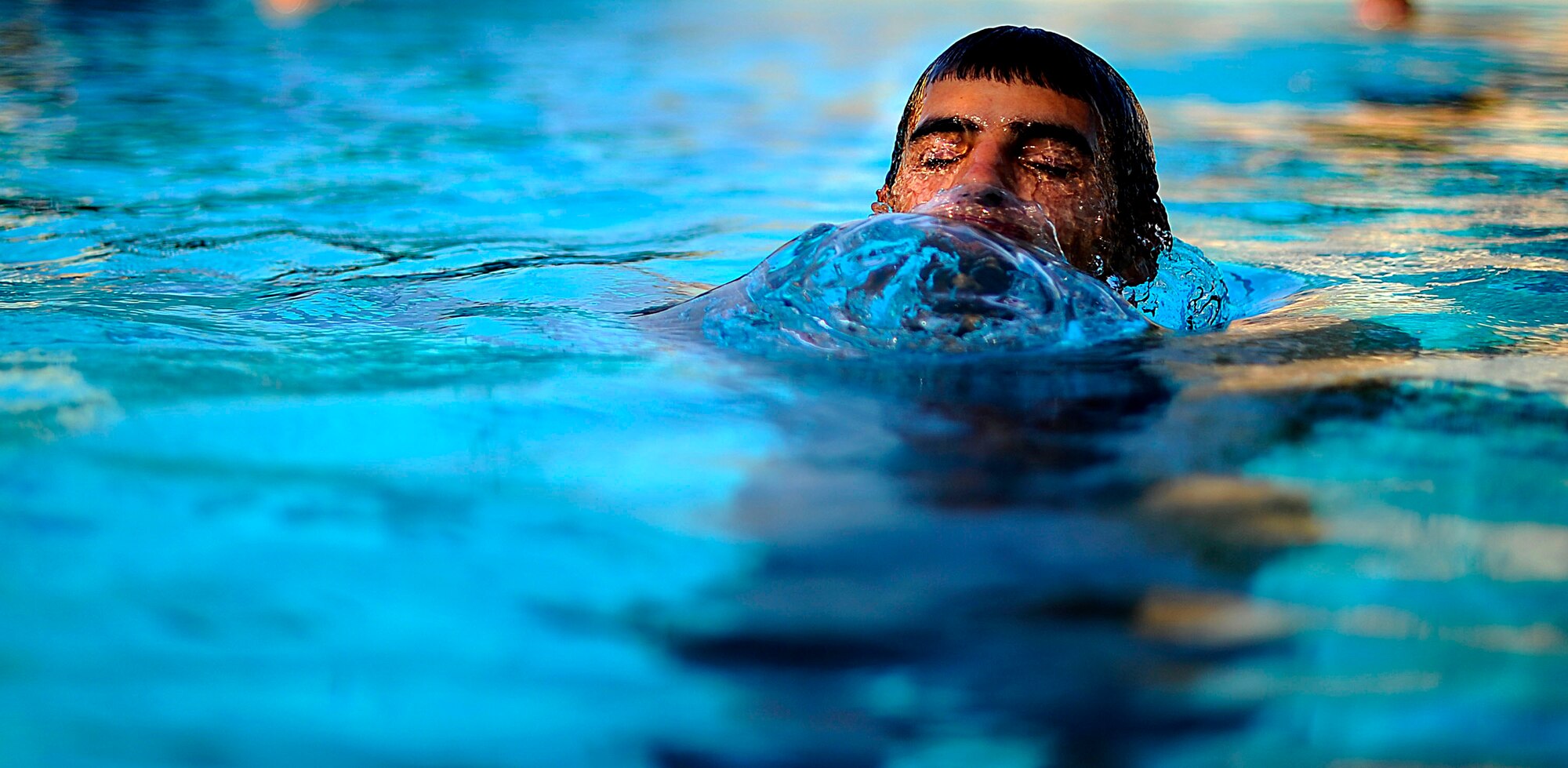A U.S. Air Force member from the Special Tactics Training Squadron, Air Force Special Operations Command, Hurlburt Field, Fla., comes up for air while participating in pre-scuba training Sept. 21, 2010. (U.S. Air Force Photo by Master Sgt. Russell E Cooley IV/Released)