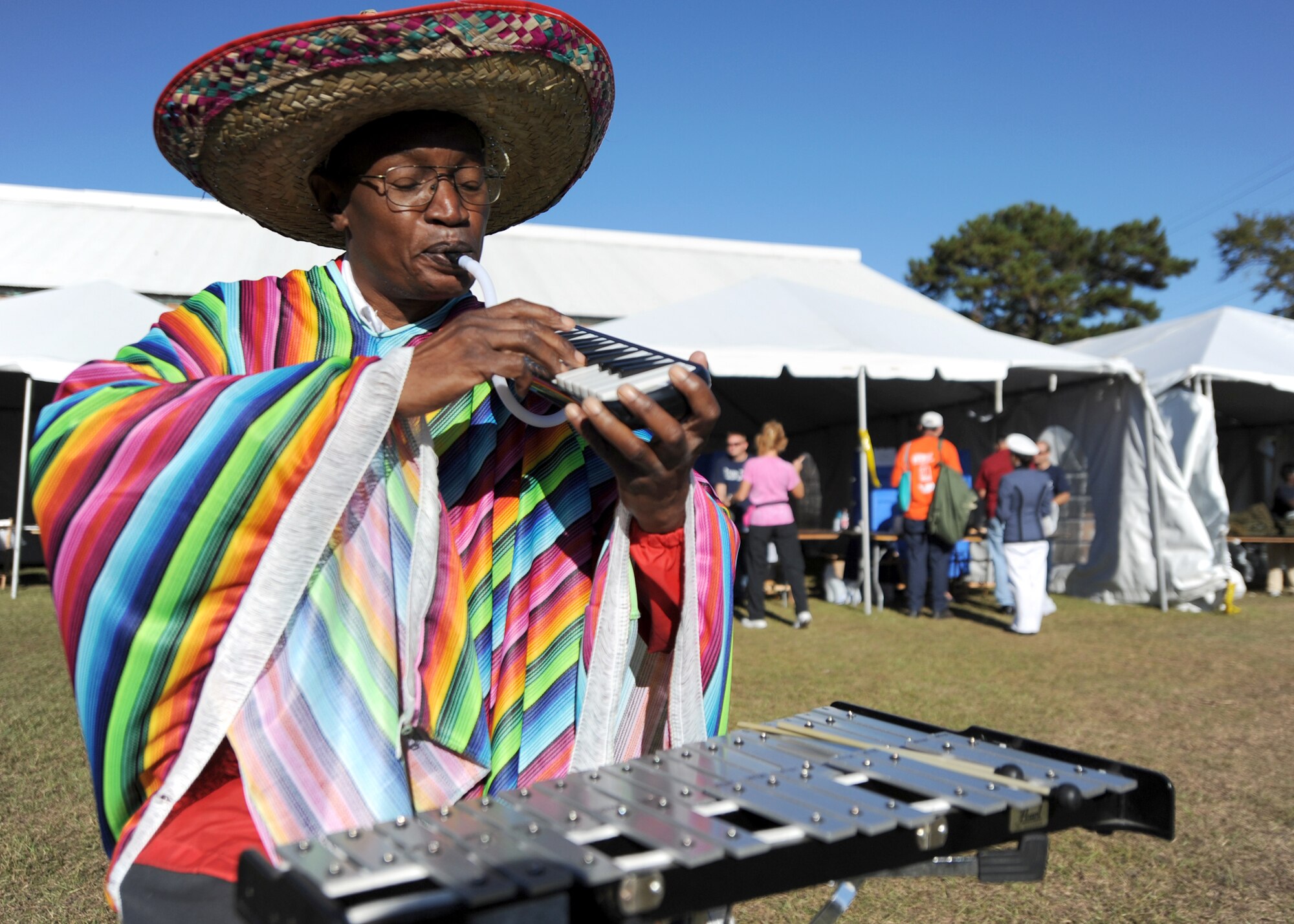 Clarence McDonald performs live gospel music as a member of the "Veterans in Arms" choir to relax and entertain visitors at the 11th annual Stand Down Against Homelessness Oct. 29, 2010, at North Charleston Armory Park, S.C. The Veterans in Arms choir is an organization that plays blues, gospel, and other relaxing genres at veterans community events. (U.S. Air Force photo/Senior Airman Timothy Taylor)