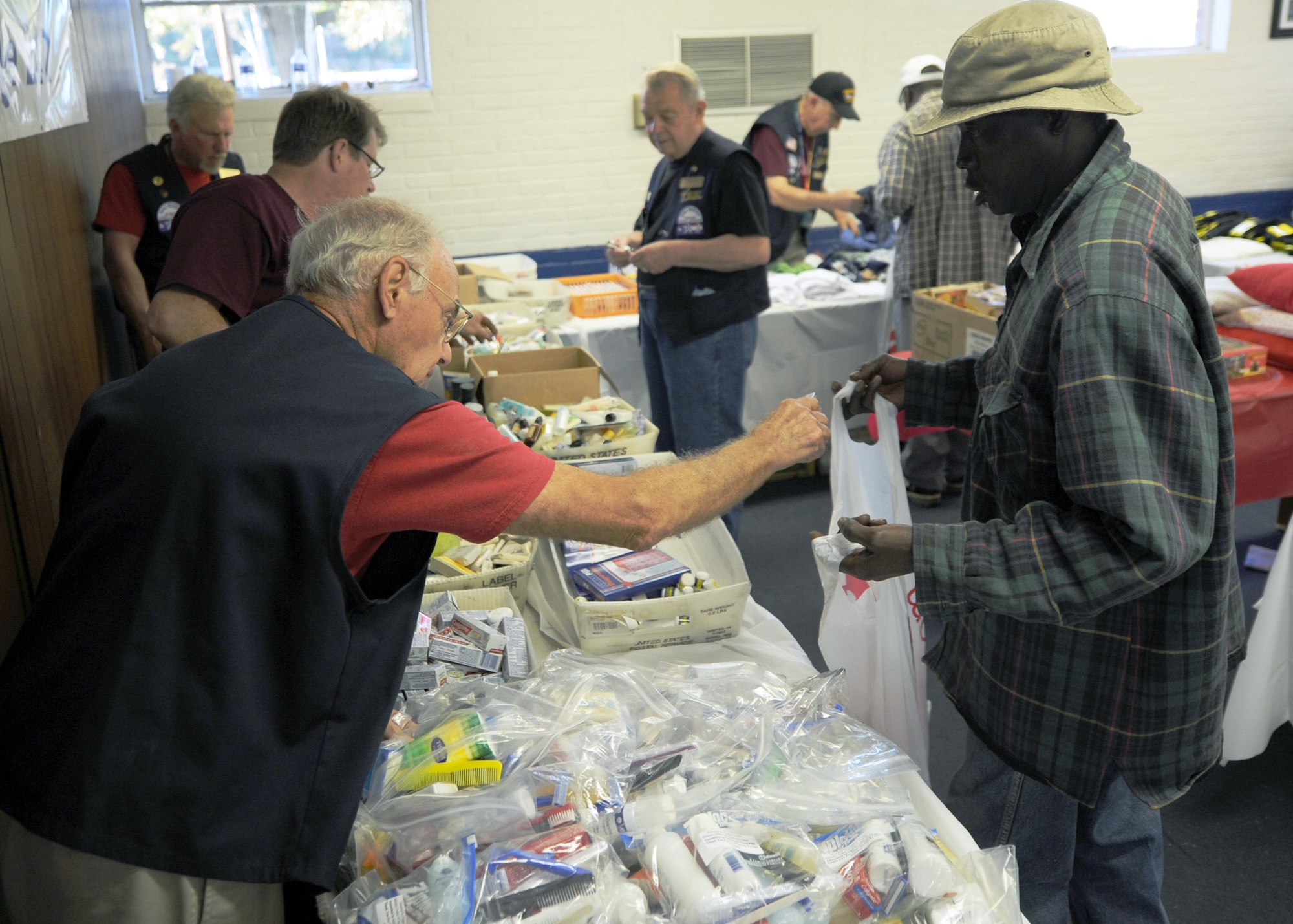 Members of the Charleston Elks Lodge 242 pass out hygiene products to homeless veterans and civilians at the 11th annual Stand Down Against Homelessness Oct. 29, 2010, at North Charleston Armory Park, S.C. The Benevolent and Protective Order of Elks is an American fraternal order and social club founded in 1868. (U.S. Air Force photo/Senior Airman Timothy Taylor)