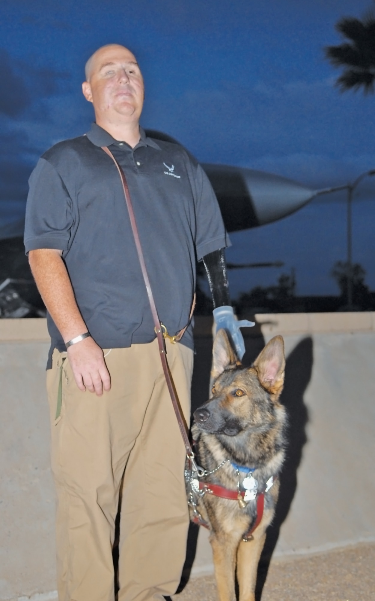 Retired Tech. Sgt. Matt Slaydon stands with his guide dog, Legend. Sergeant Slaydon teamed with Legend three years after he lost his sight and left arm in an improvised explosive device explosion in October, 2007, in Kirkuk Iraq. (U.S. Air Force photo/Austin Thomas)