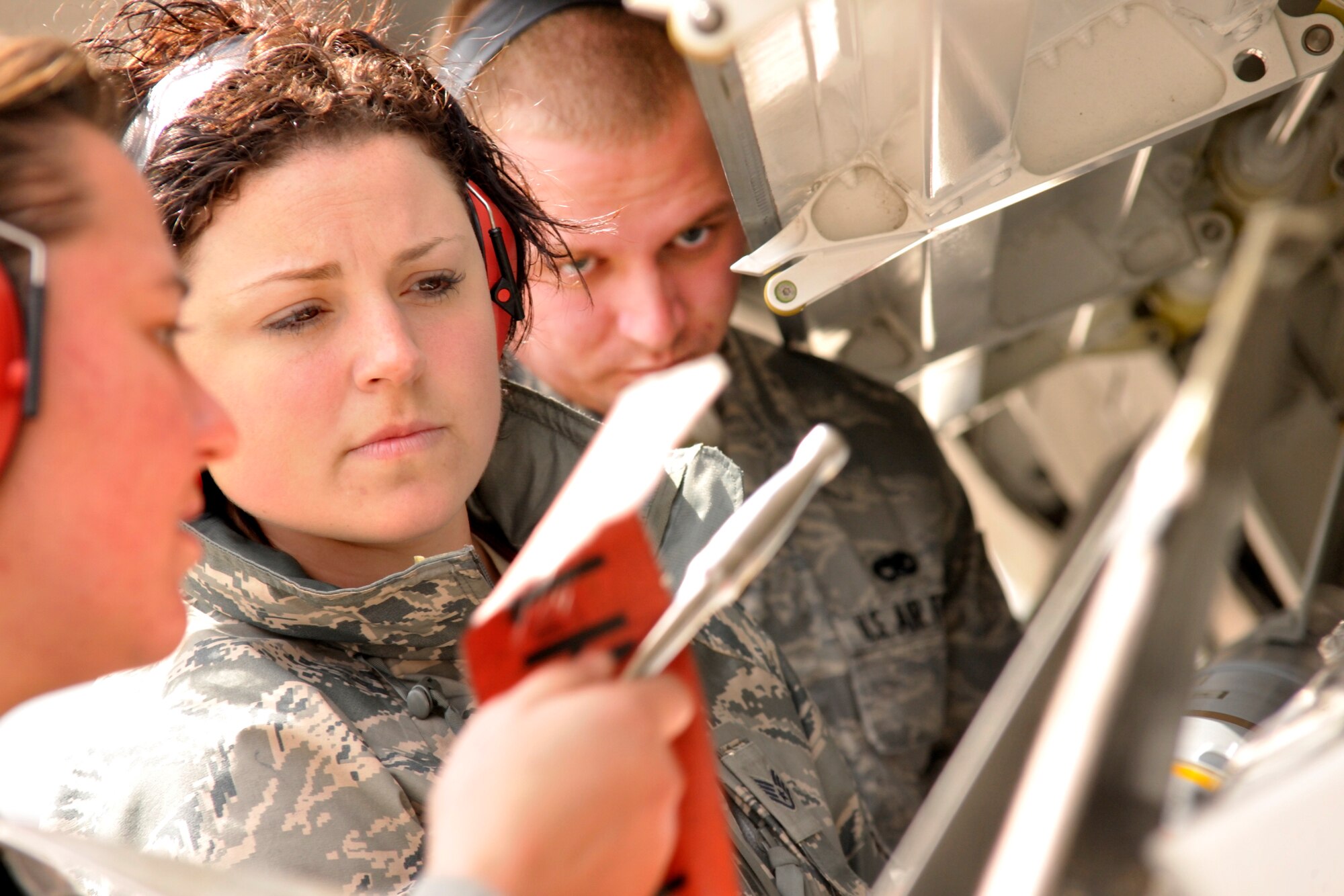 Members from the 90th Aircraft Maintenance Unit load an AIM-9 onto an F-22 Thursday.  Members from the 90th AMU, 90th Fighter Squadron, and the 302nd Fighter Squadron deployed to Tyndall AFB, Fla. to take part in the Weapons Systems Evaluation Program.  During this three-week deployment, pilots and maintainers are working together to validate the air-to-air combat capability of the newest F-22 Raptors in the Air Force inventory.  WSEP’s full mission includes loading missiles, flying with and firing missiles and hitting targets.  (U.S. Air Force photo/Technical Sgt. John Hoffman)