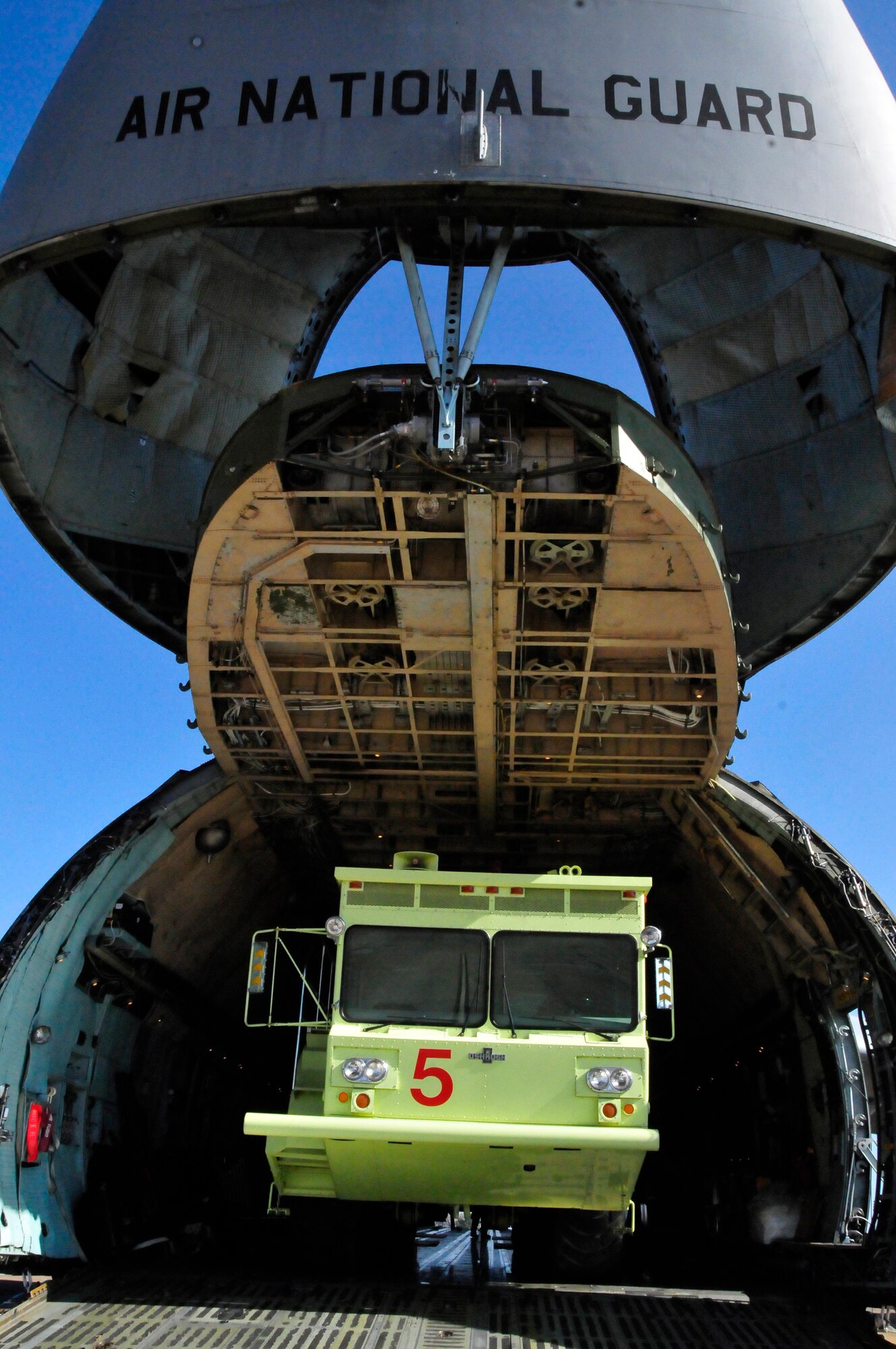 A P-15 Airport Rescue Firefighting Truck (ARFF) is loaded onto a C-5 Galaxy from New York Air National Guard for transport from the 134 ARW, McGhee Tyson Air National Guard Base, Tennessee to the 101st ARW, Bangor, Maine.  The truck has been in commission at MTAB since 1991 and is believed to be one of the last manufactured of its kind.  (US Air Force photo by Tech. Sgt. Kendra Owenby, 134 ARW Public Affairs/Released by Capt. Gary Taft, 134 ARW PAO)