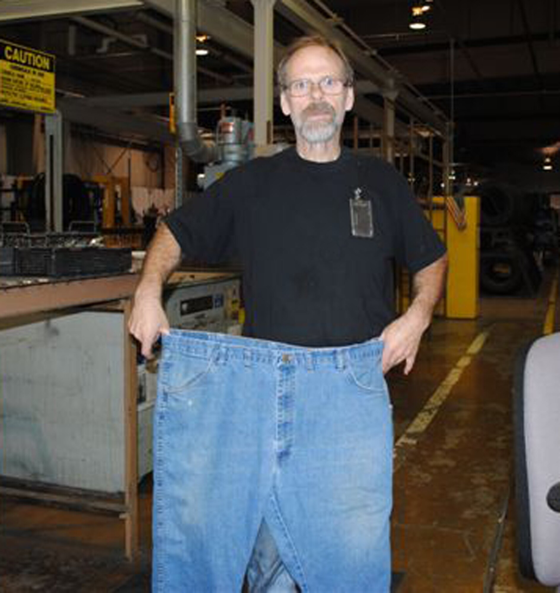 Thanks to the Fit for Life fitness program and a Type 2 Diabetes diagnosis, Gregory Hightower has lost more than 100 pounds in a little more than a year. Mr. Hightower, who works in the 552nd Commodities Maintenance Squadron Tire Shop, dropped 12 pant sizes. He now buys 32-inch jeans instead of the 44-inch pants he used to wear. (Courtesy photo)